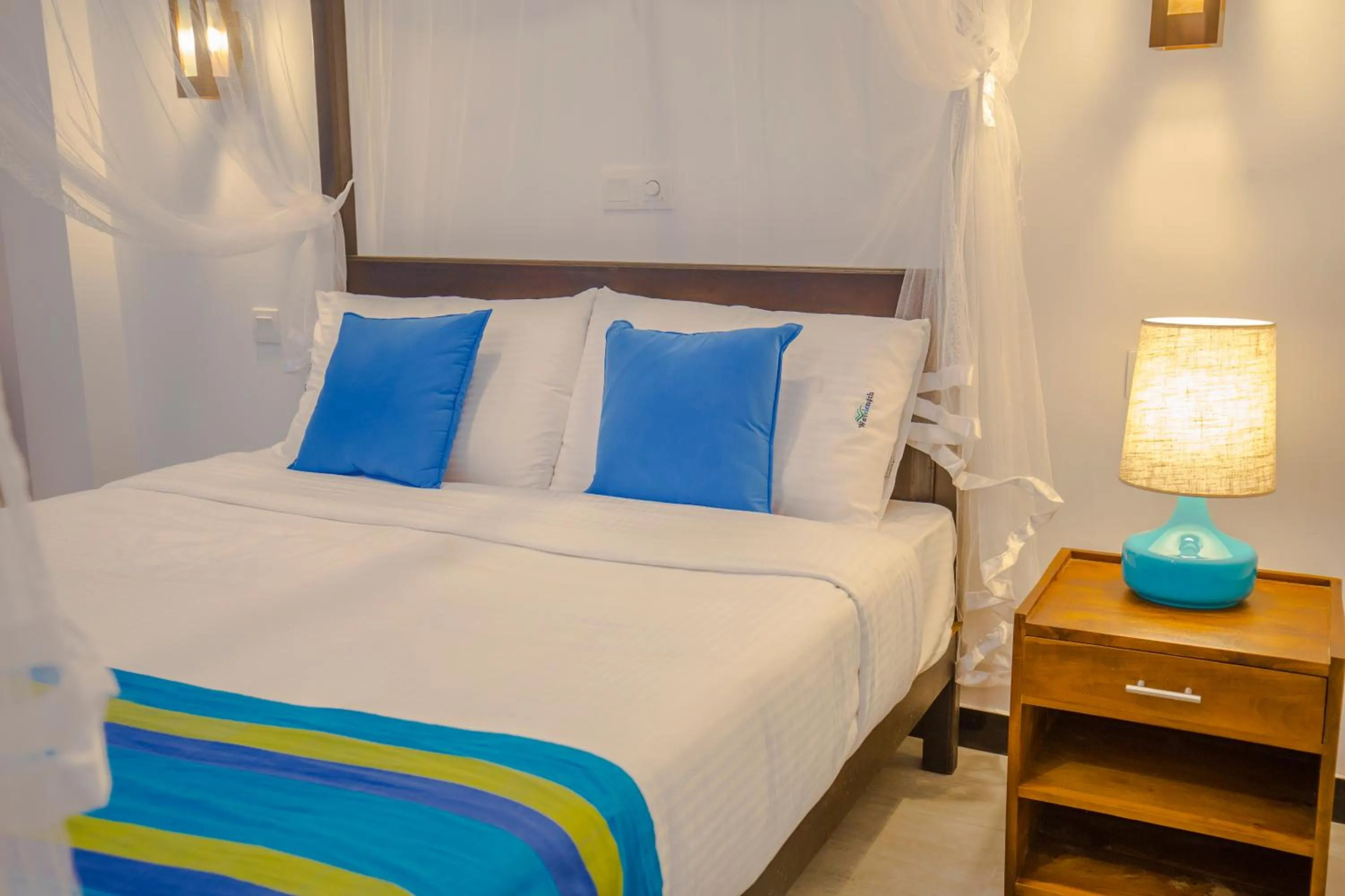 Bed in Wavelength Hotel & Wellness Center