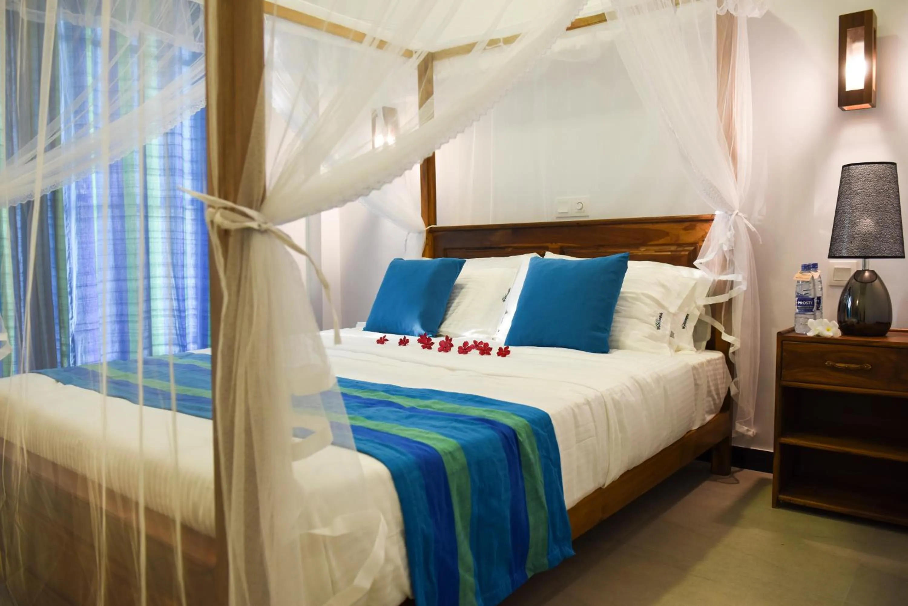 Bed in Wavelength Hotel & Wellness Center