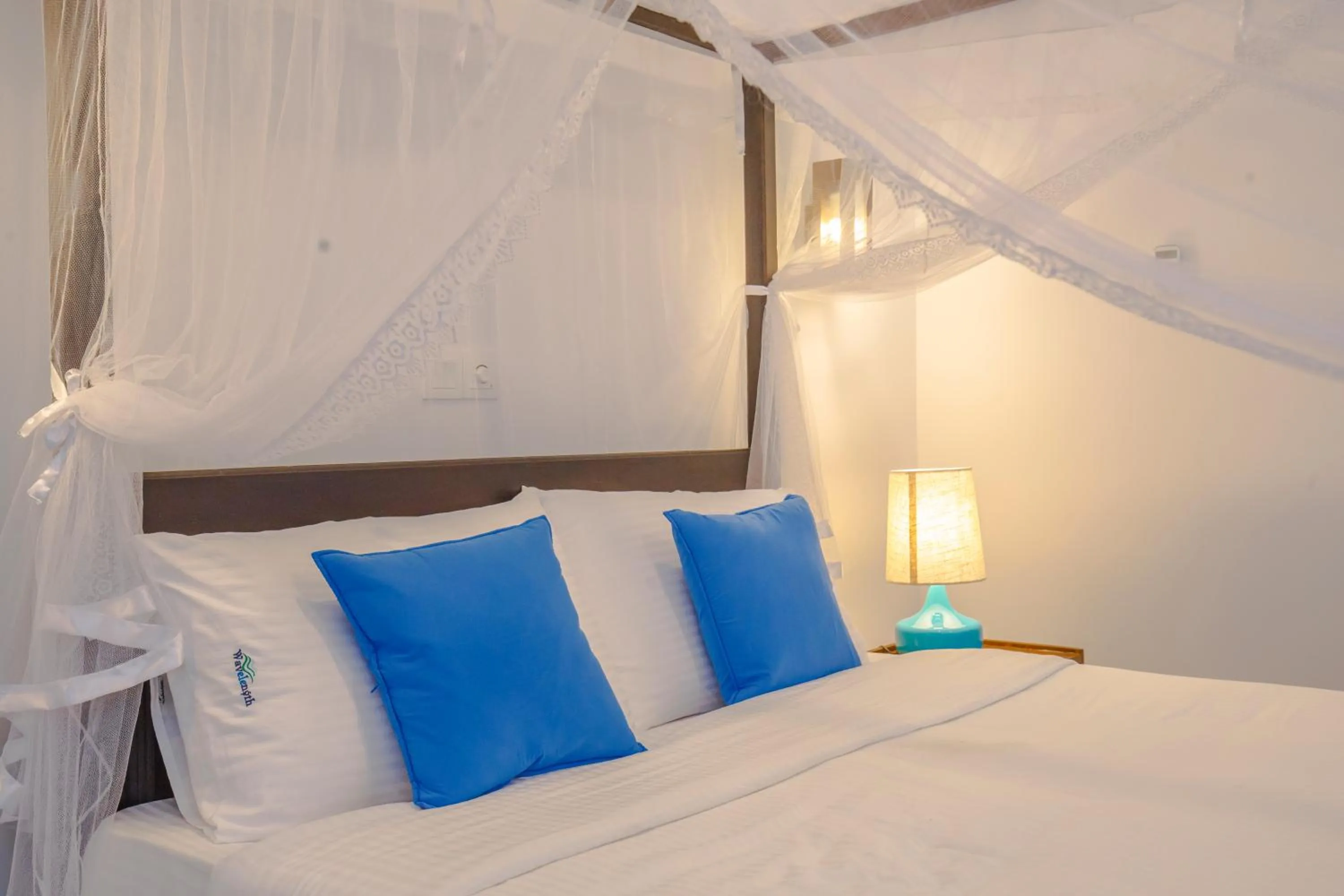 Bed in Wavelength Hotel & Wellness Center