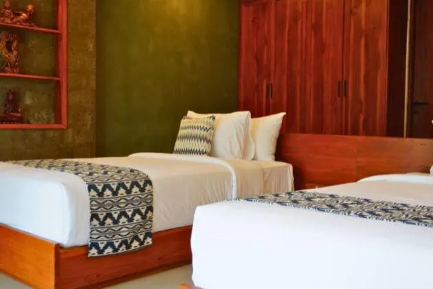 Bed in Uma Dawa Resort and Spa