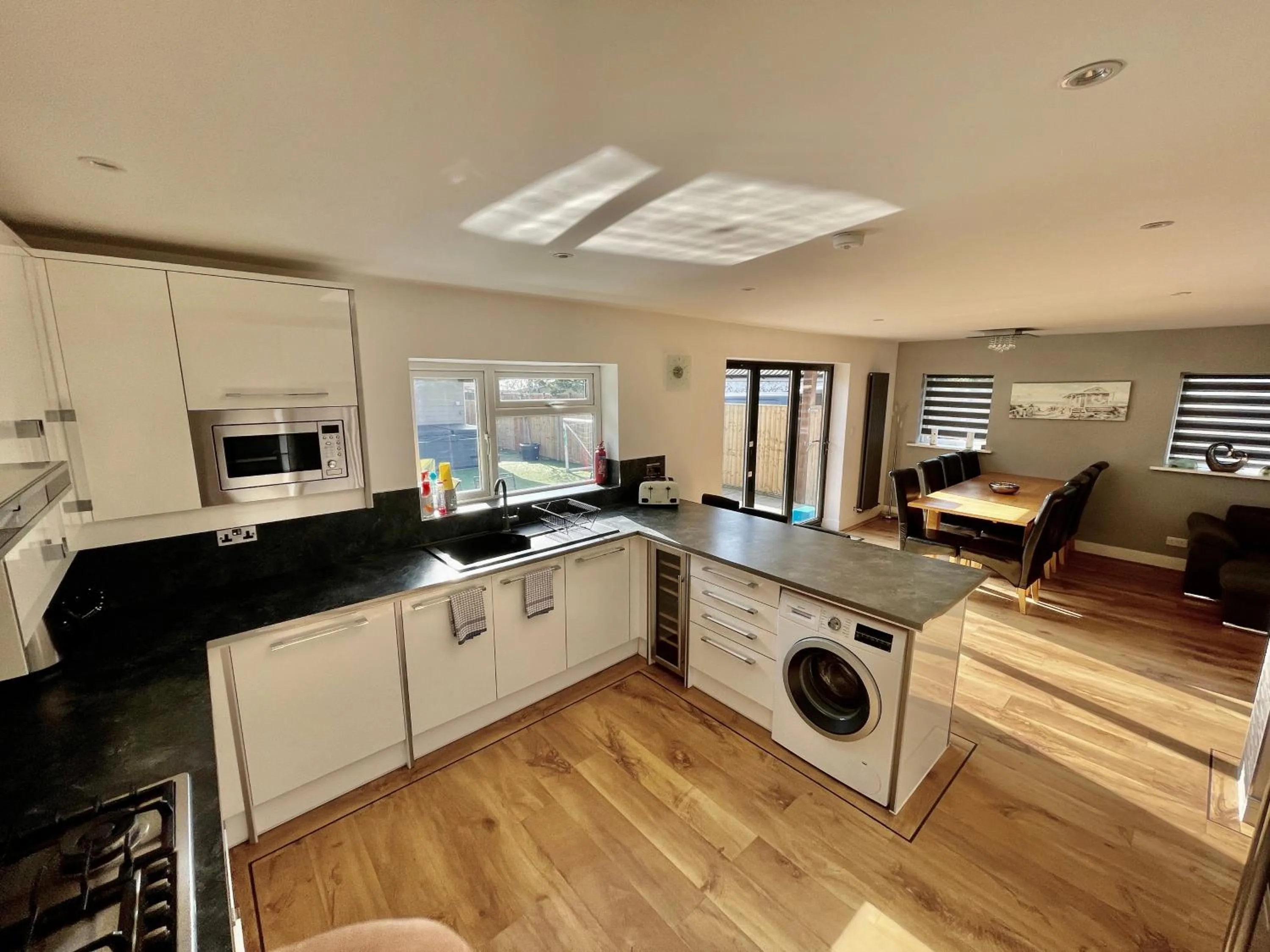 Communal kitchen in Four Corners Holiday Home Hot Tub & Sauna