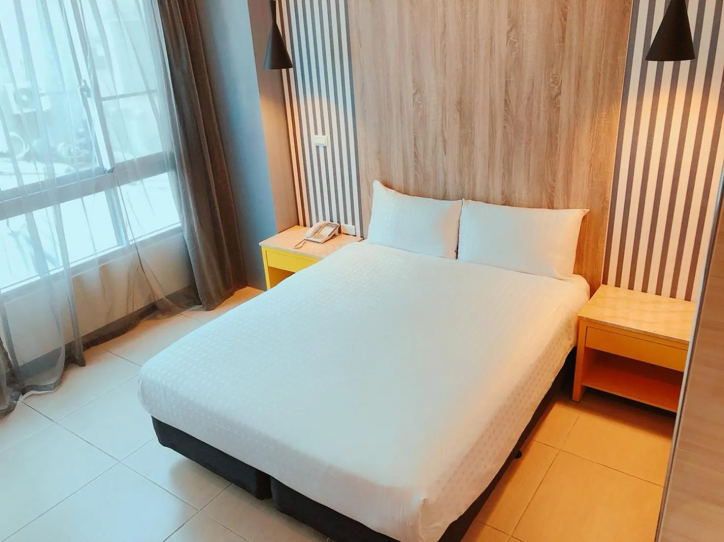 Bed in P&E Hotel