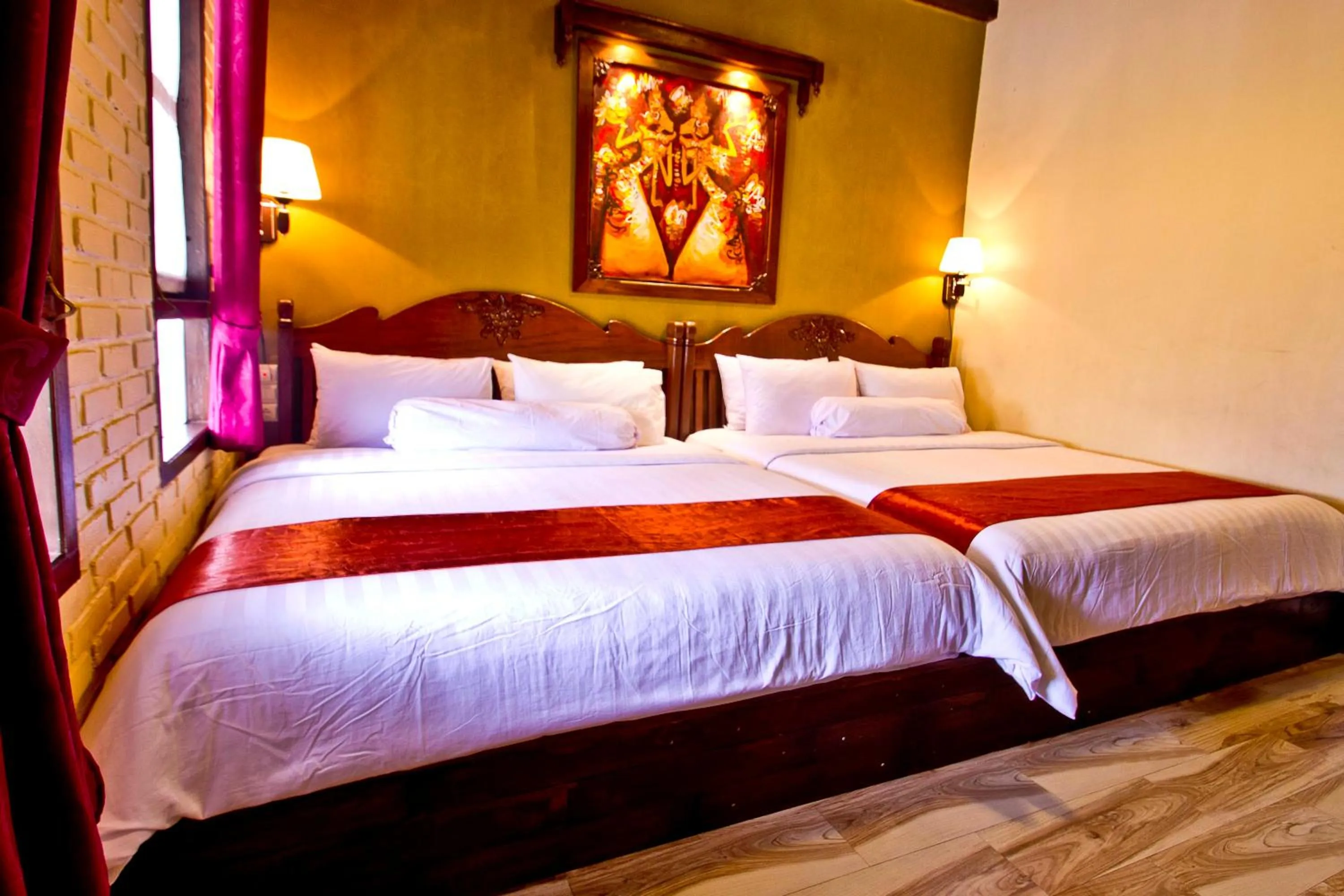 Bed in Puri Sakanti Nature Family Resort