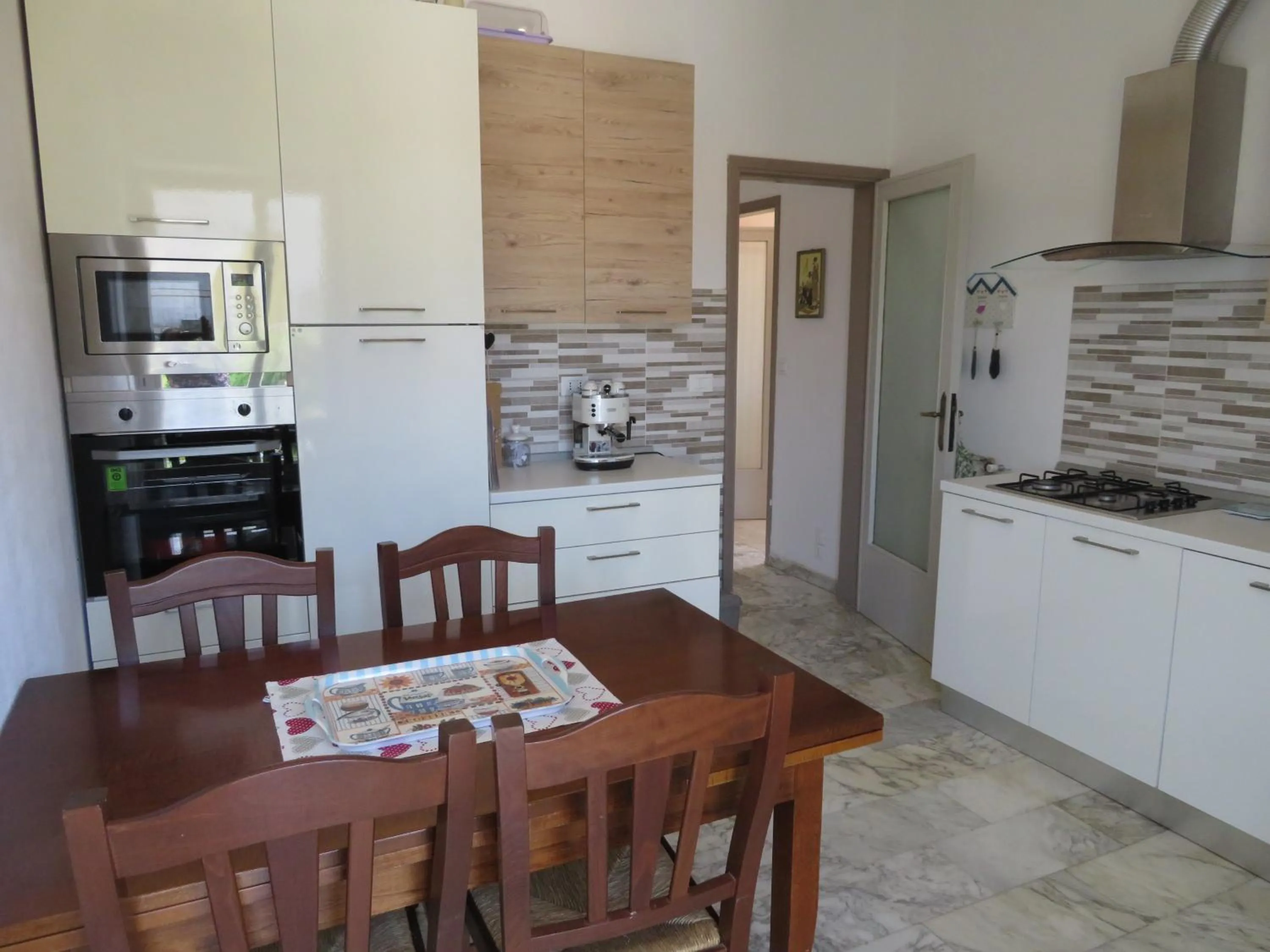 Communal kitchen in La Mimosa Chic