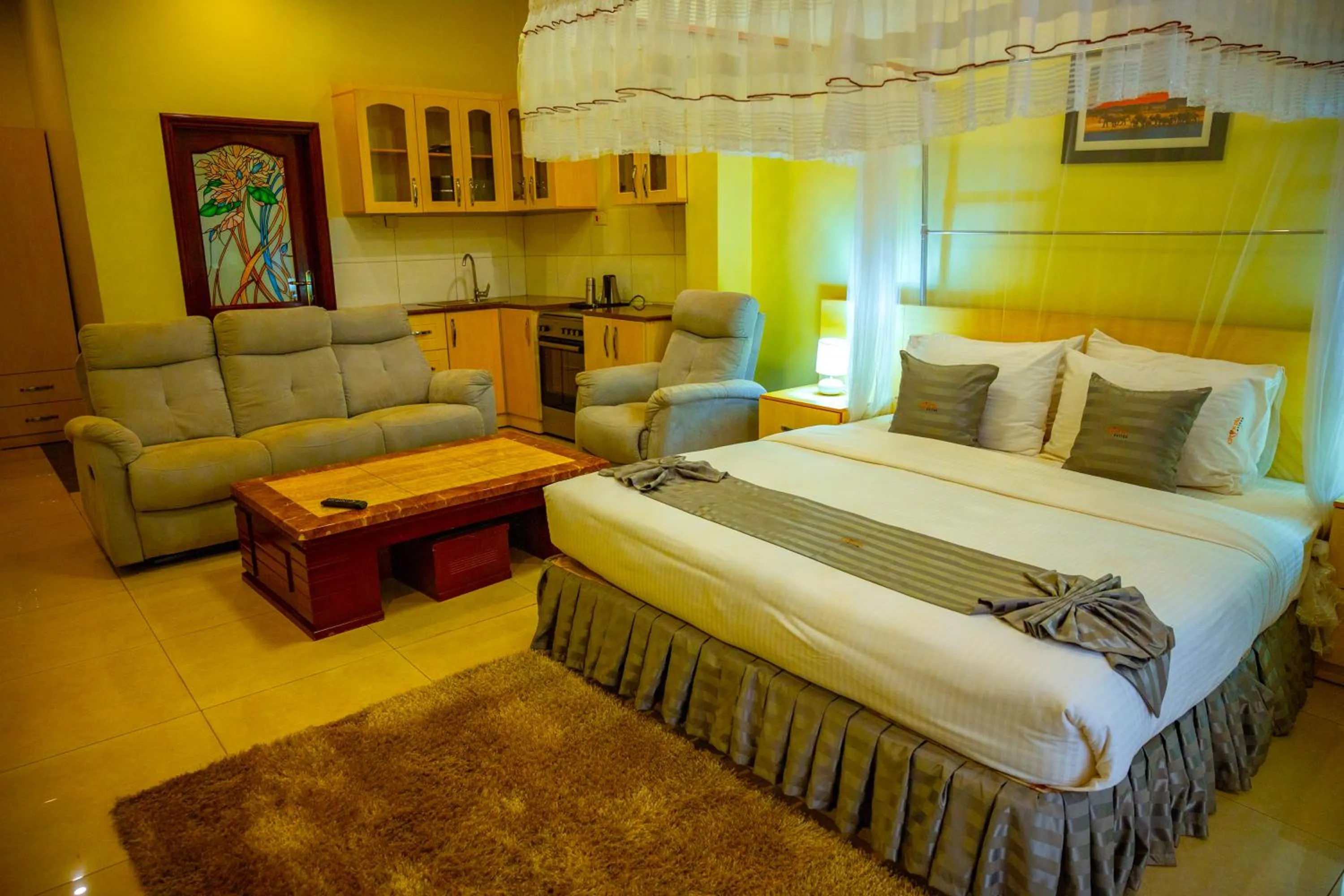 Living room, Bed in Crystal Suites & Apartments