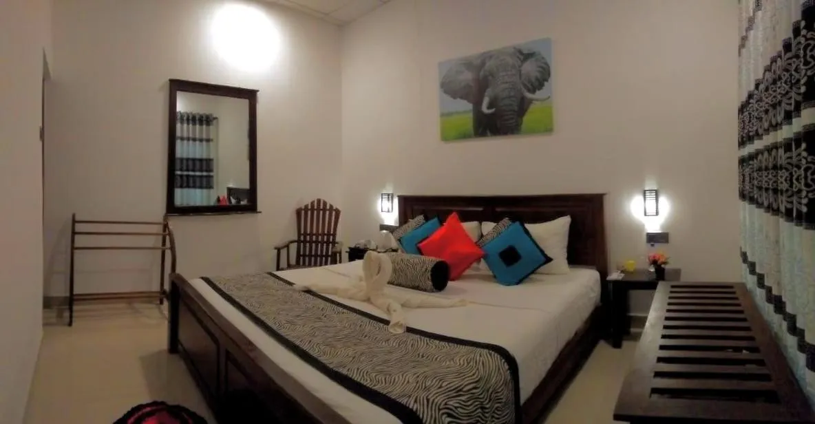 Bed in Levona Garden Resort