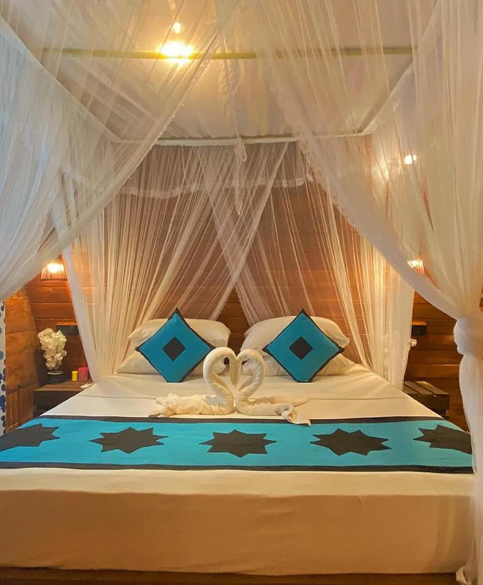 Bed in Levona Garden Resort