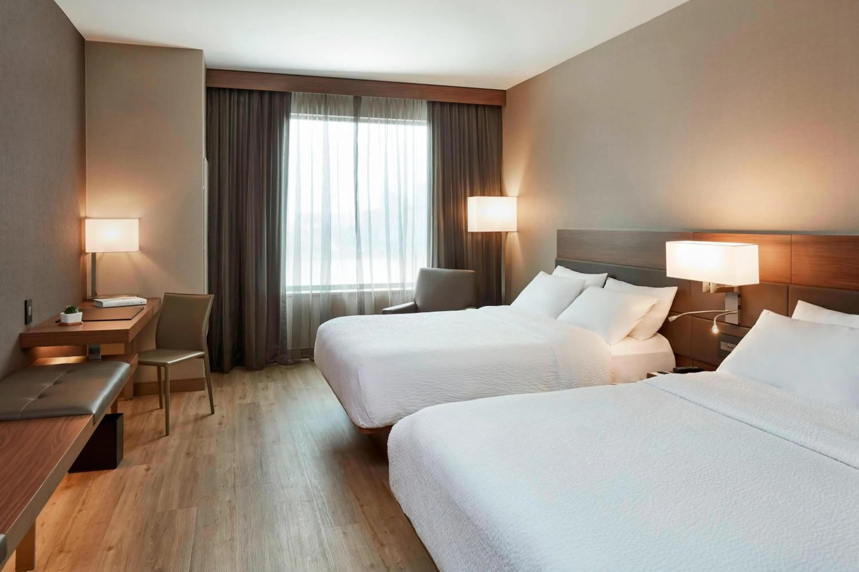 Photo of the whole room, Bed in AC Hotel by Marriott Cincinnati at The Banks