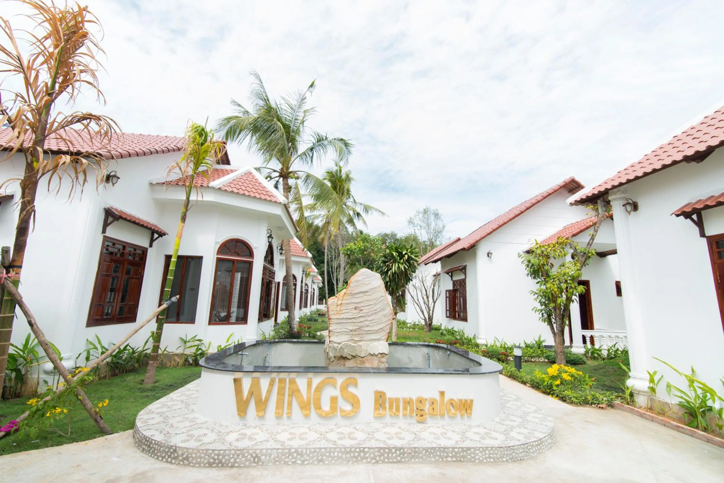 Property logo or sign in Wings Bungalow