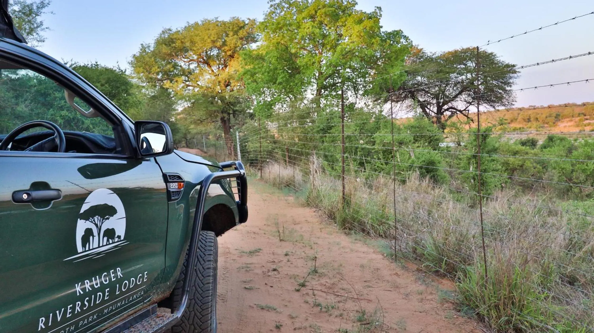Property logo or sign in Kruger Riverside Lodge - No Load-shedding