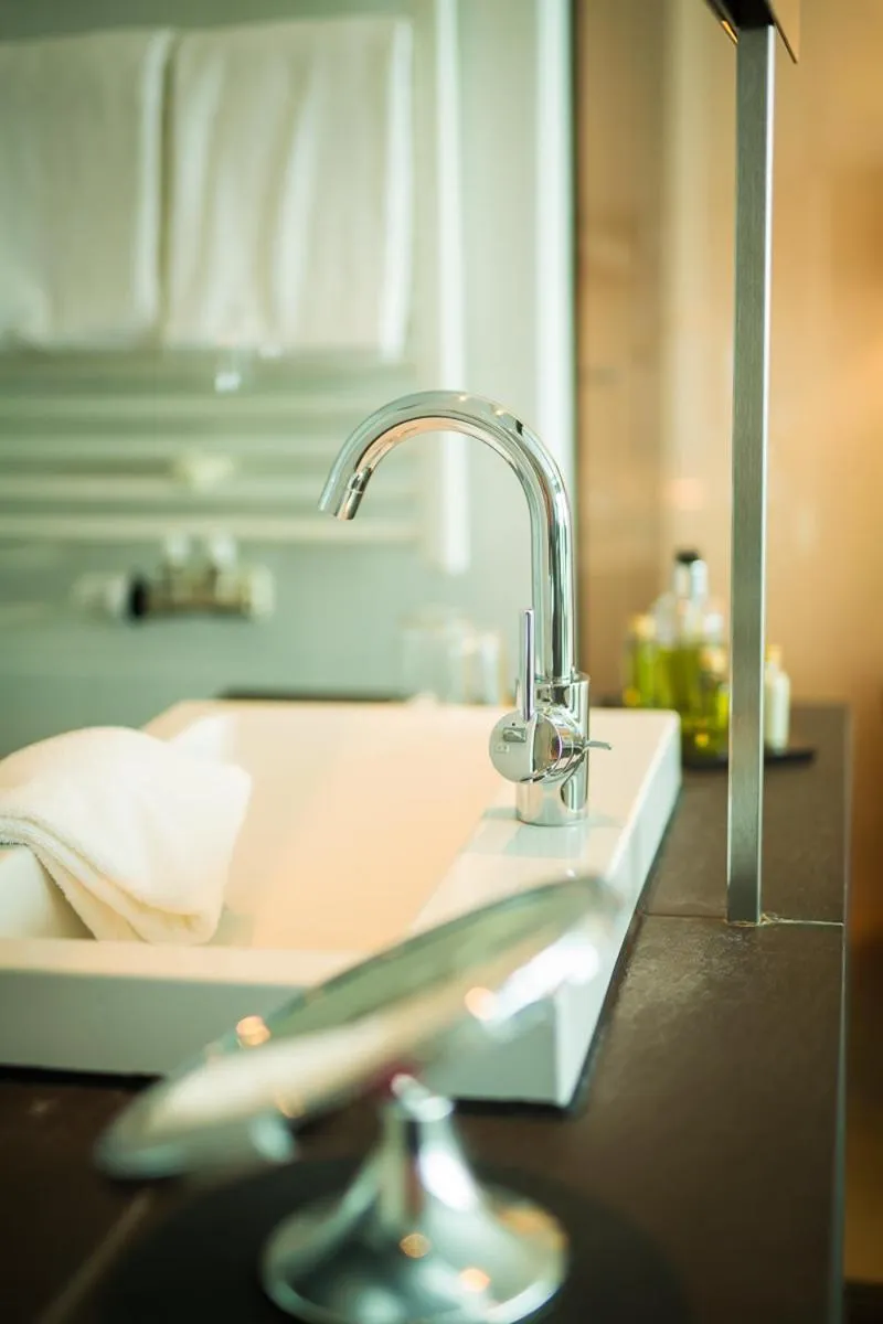 Bathroom in aika seaside living hotel