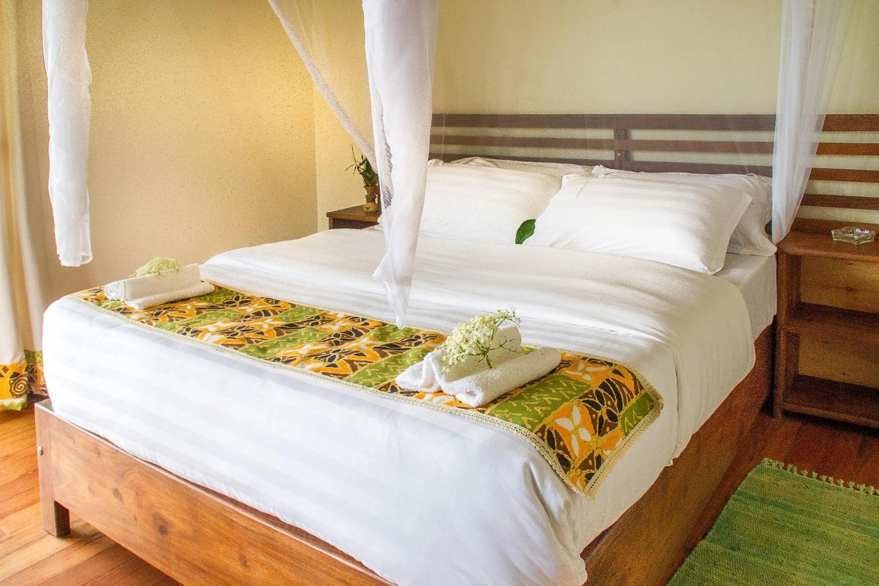 Bed in Ichumbi Gorilla Lodge