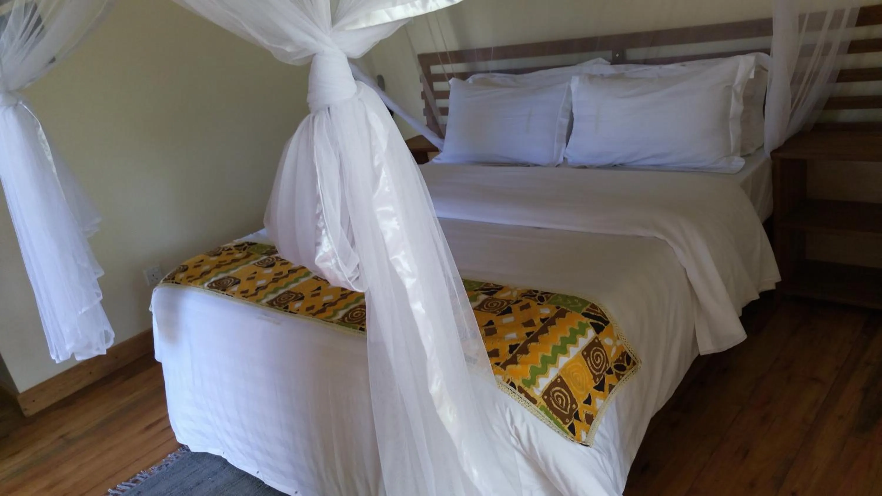 Bed in Ichumbi Gorilla Lodge