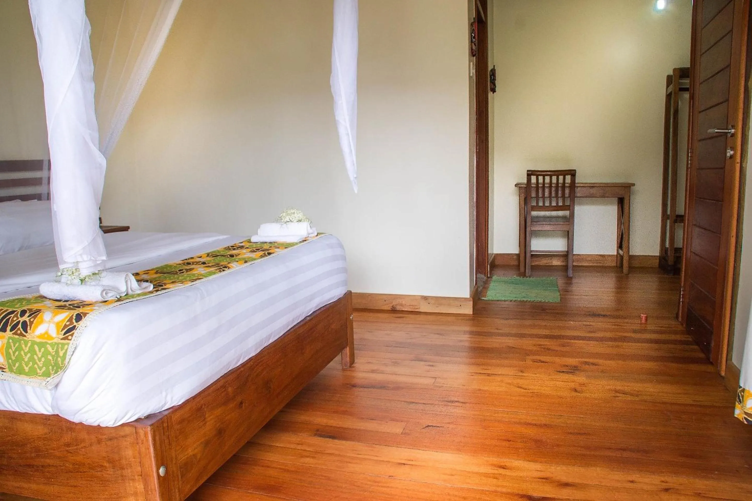 Bed in Ichumbi Gorilla Lodge