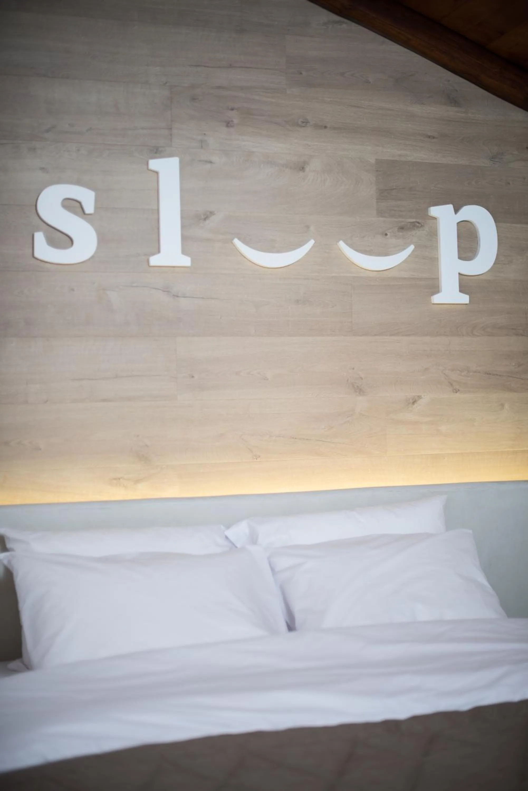 Decorative detail, Bed in Olganos VL Luxury Rooms & Suites