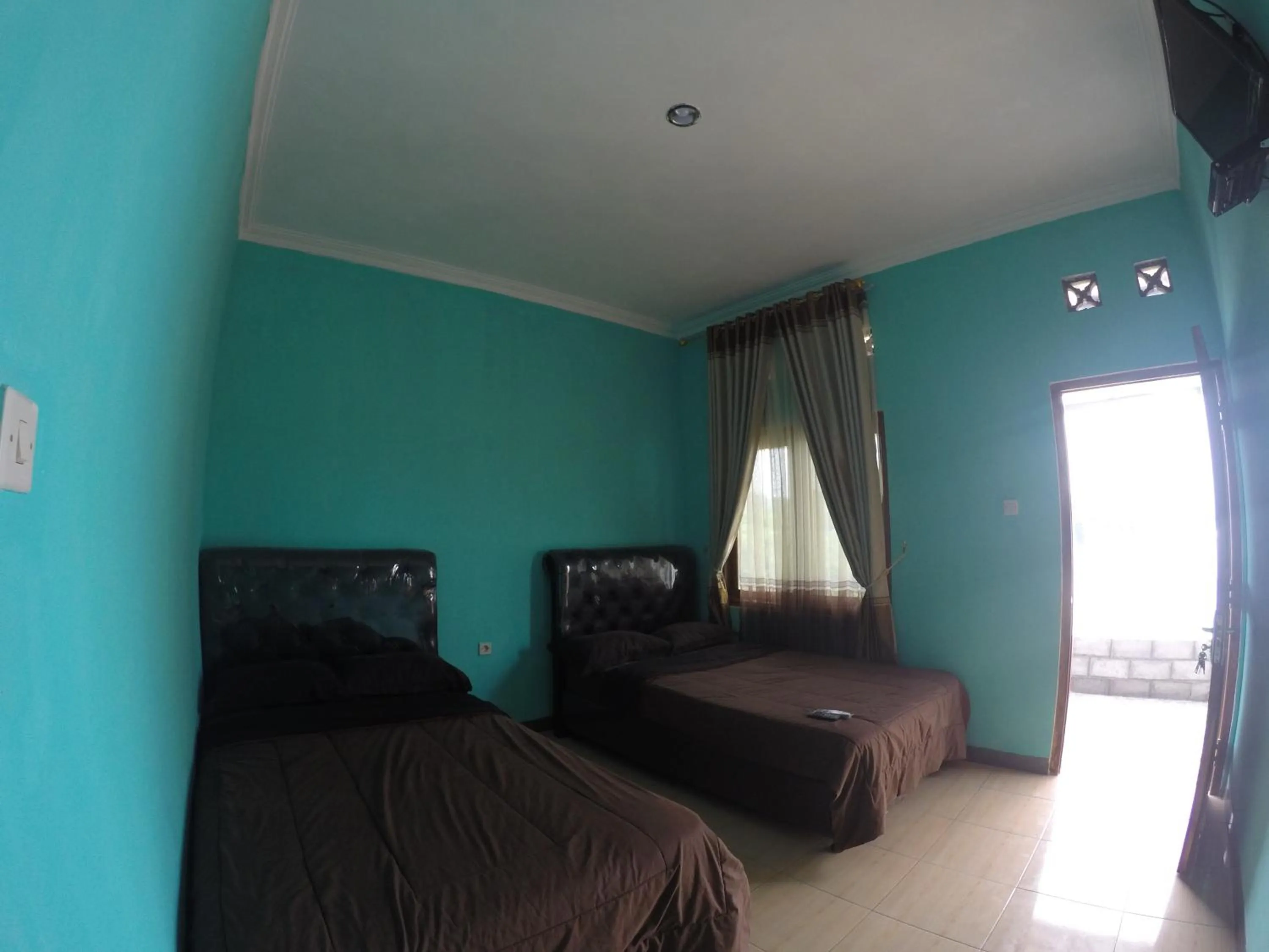 Bed in Omah Sundak Homestay