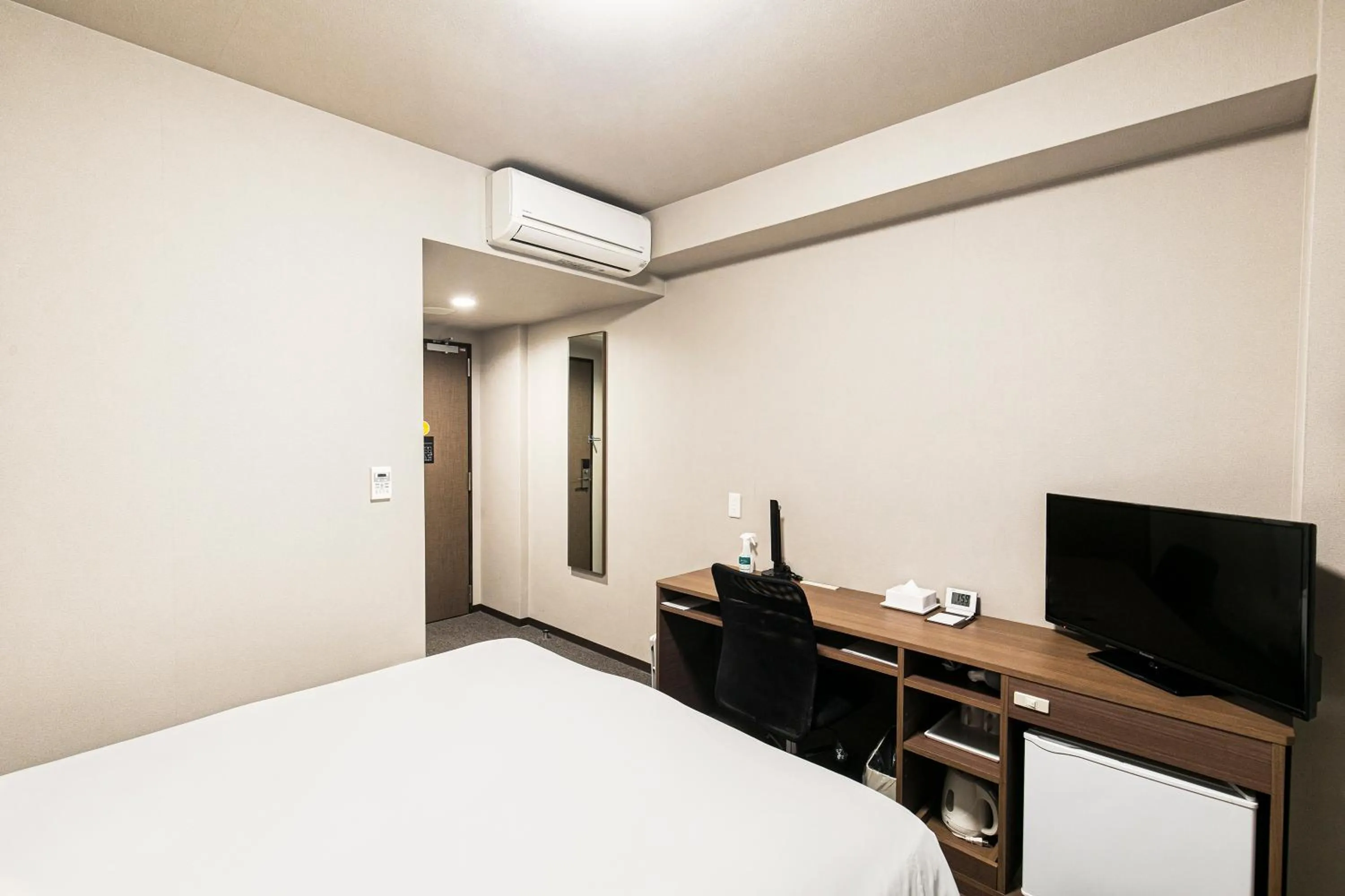 Bed in Smile Hotel Hakataekimae