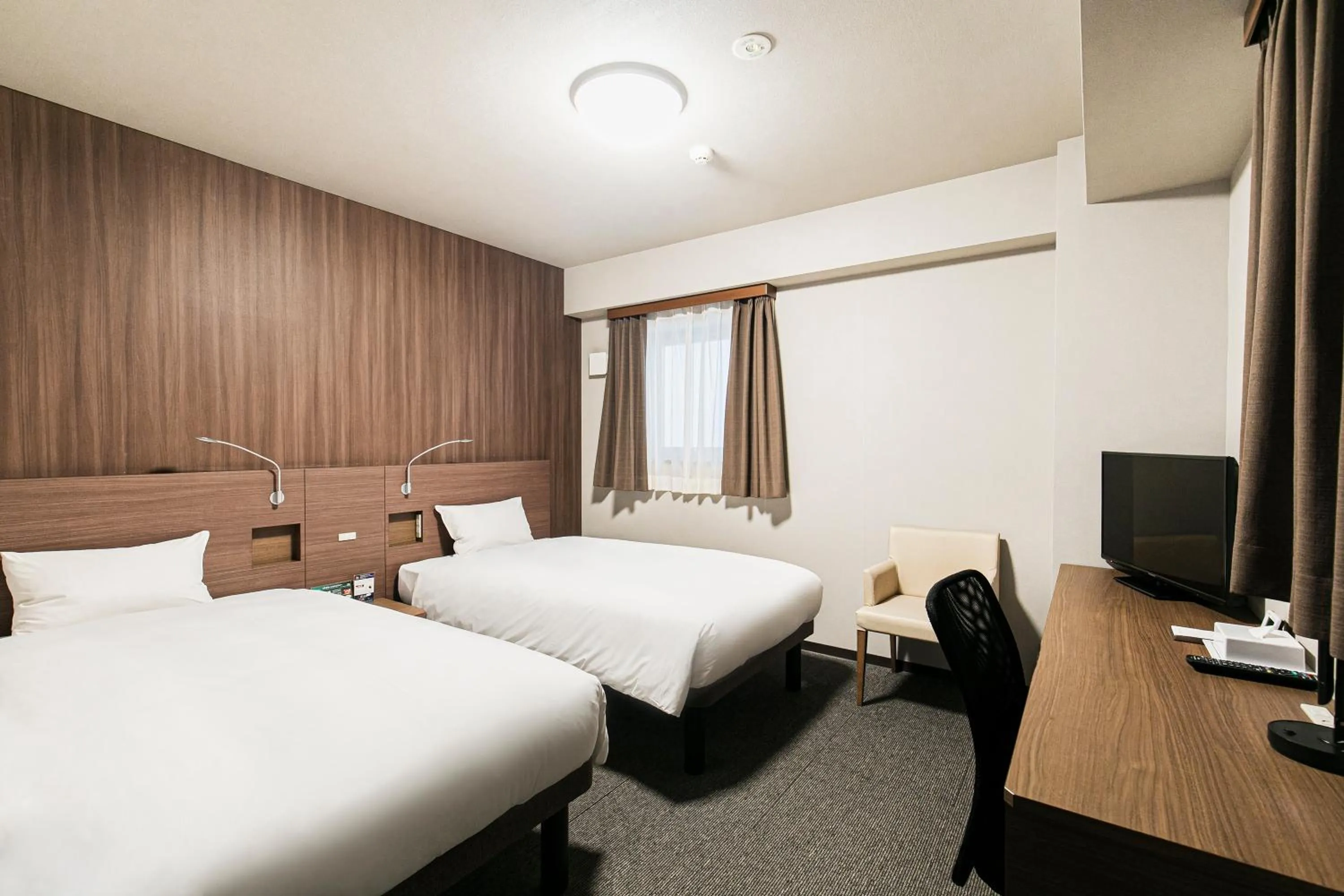 Bed in Smile Hotel Hakataekimae