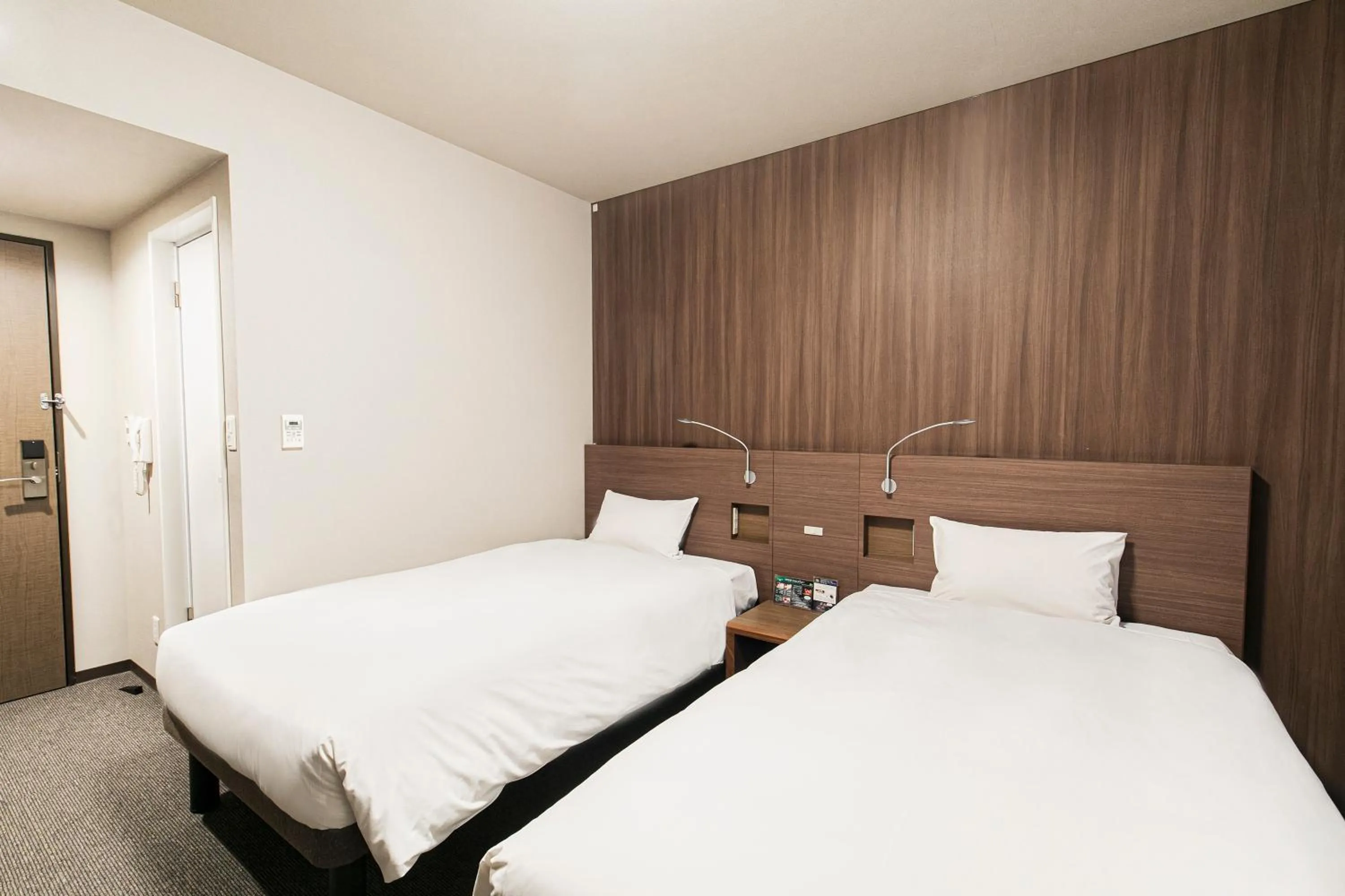 Bed in Smile Hotel Hakataekimae