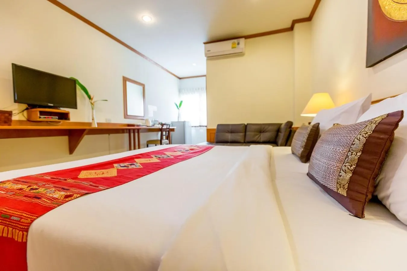 Bed in Loei Village Hotel