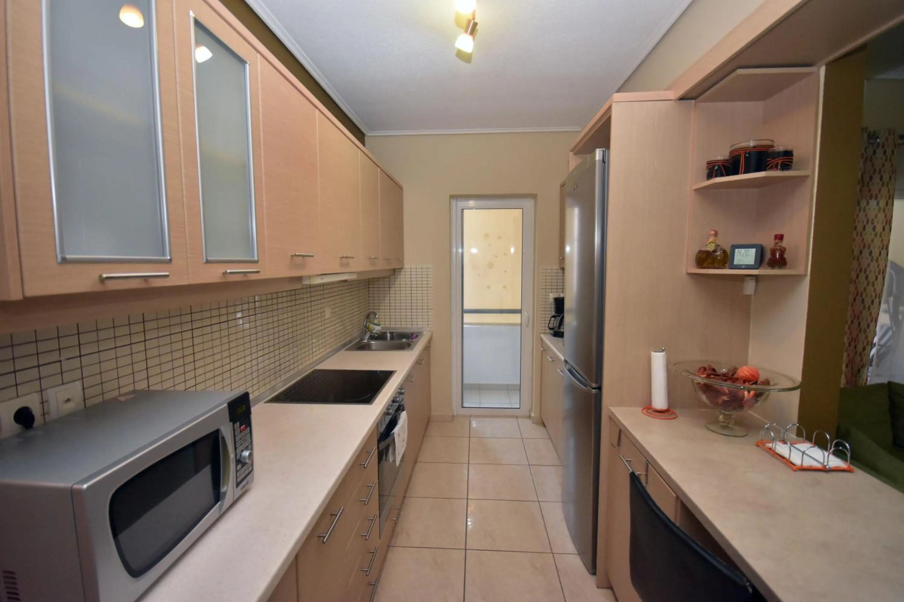Kitchen or kitchenette in A&J Apartments or Rooms athens airport