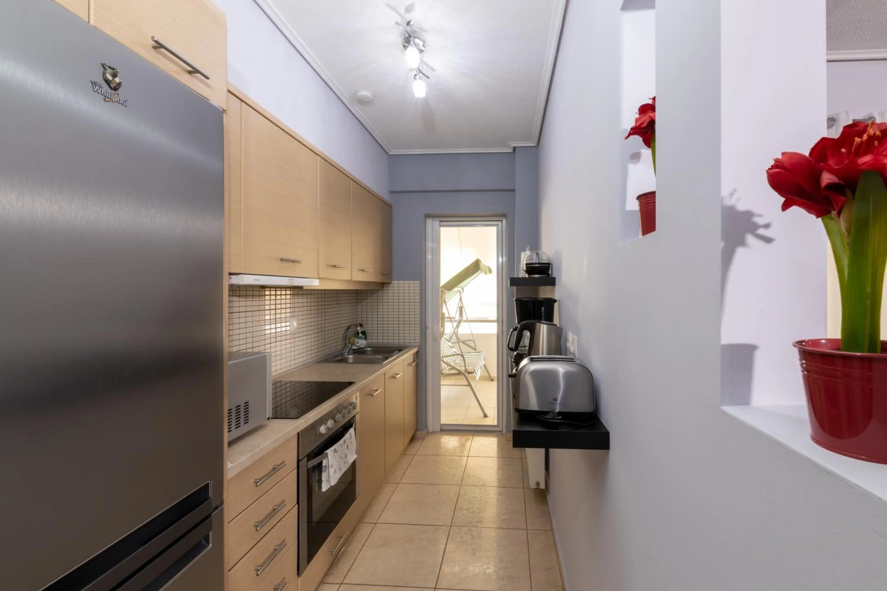 kitchen in A&J Apartments or Rooms athens airport