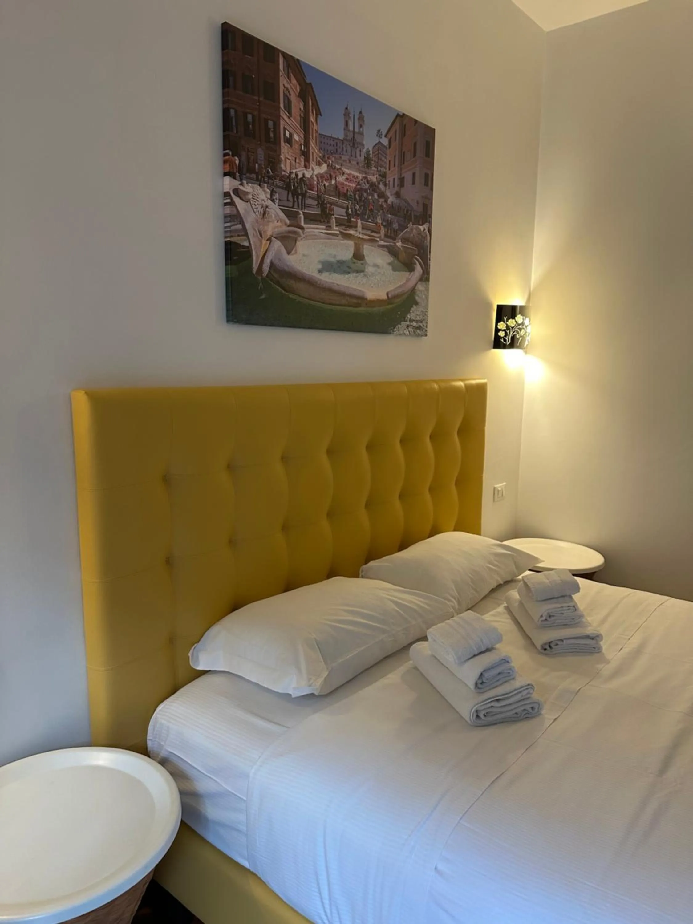 Bed in Vatican QG Rooms