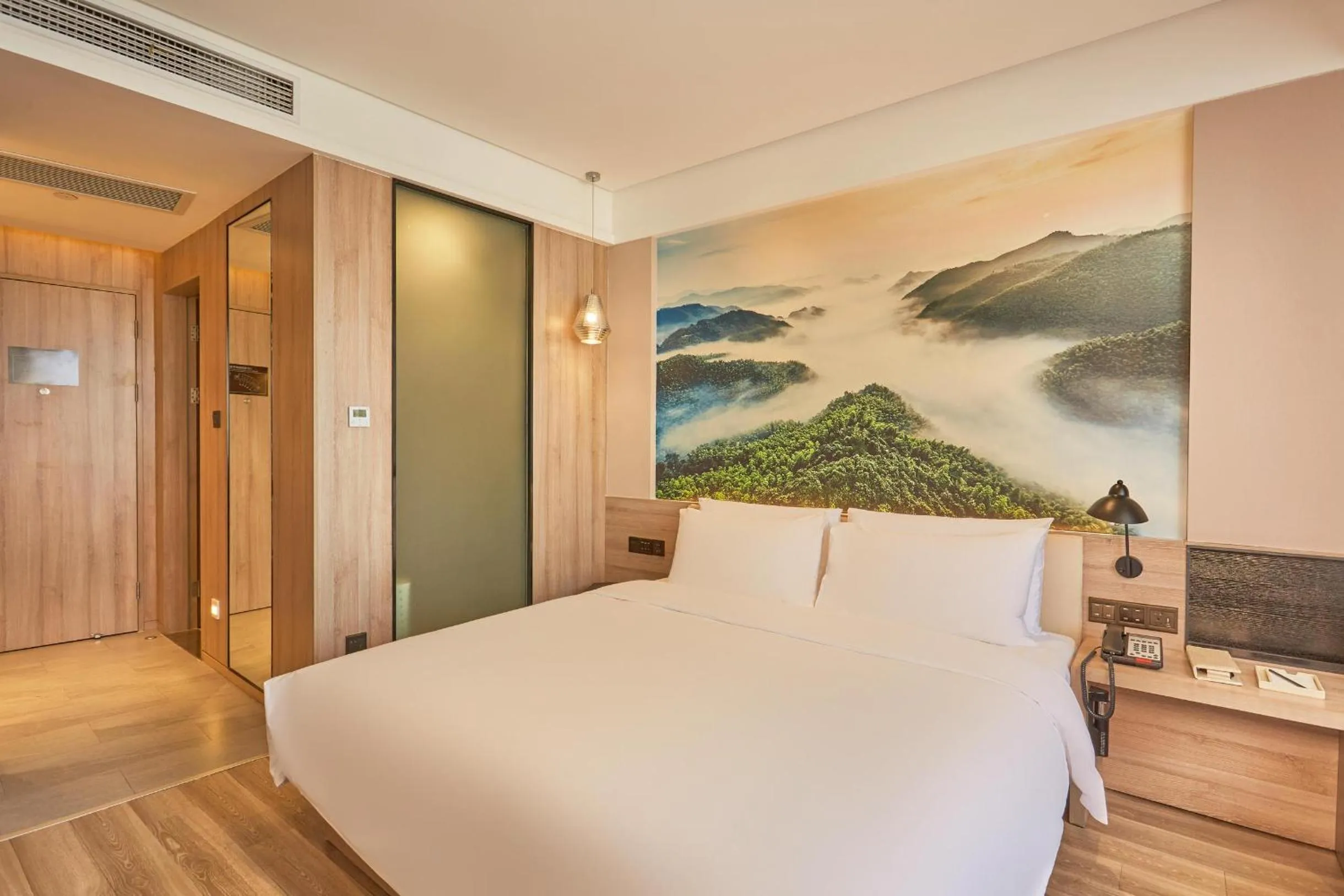 Bed in Ningbo Tianyi Square Atour Hotel