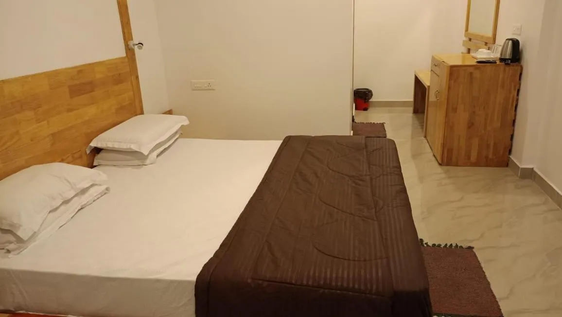 Bed in Coconhuts Beach Resort