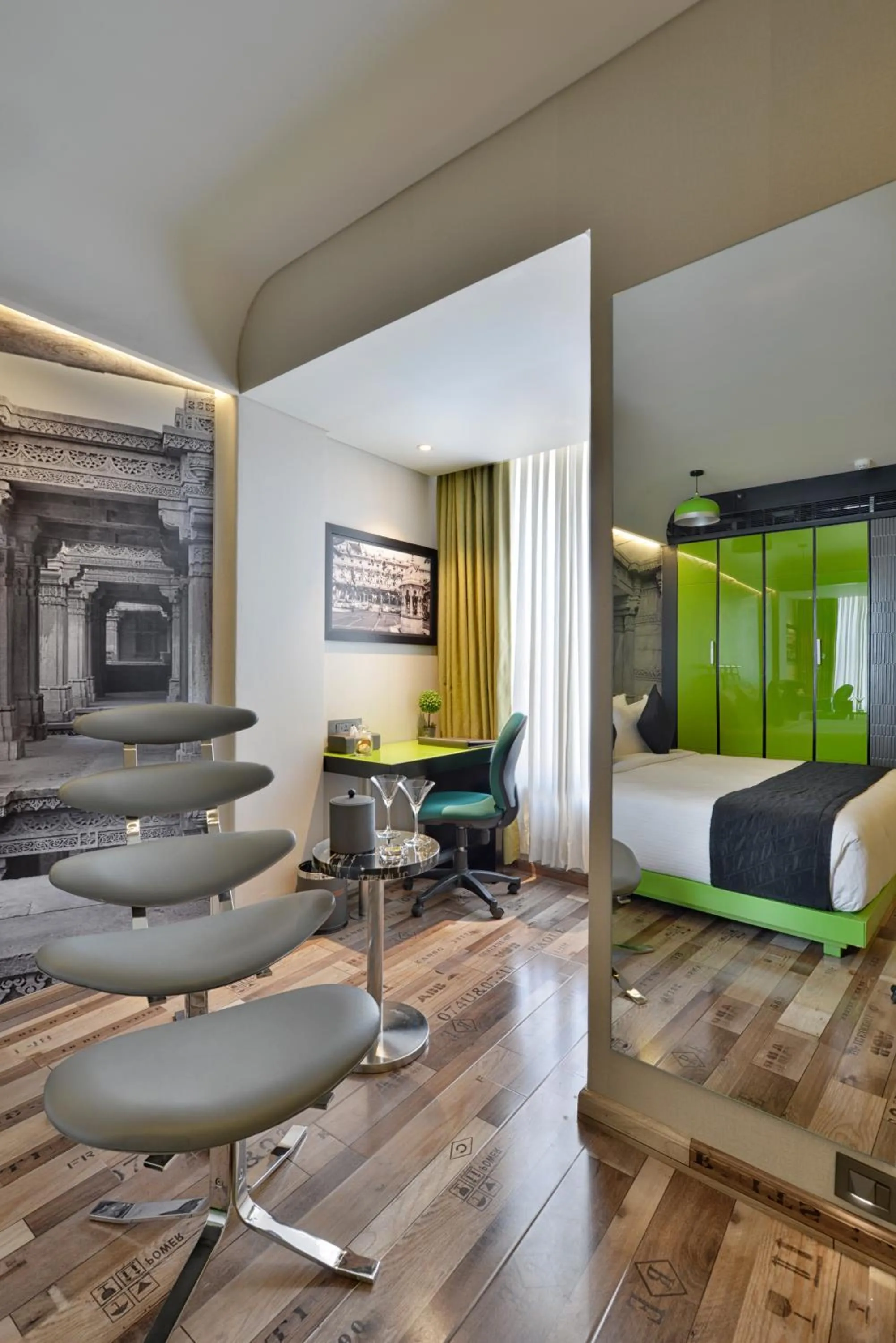 Seating area, Bed in Regenta Central Antarim Ahmedabad