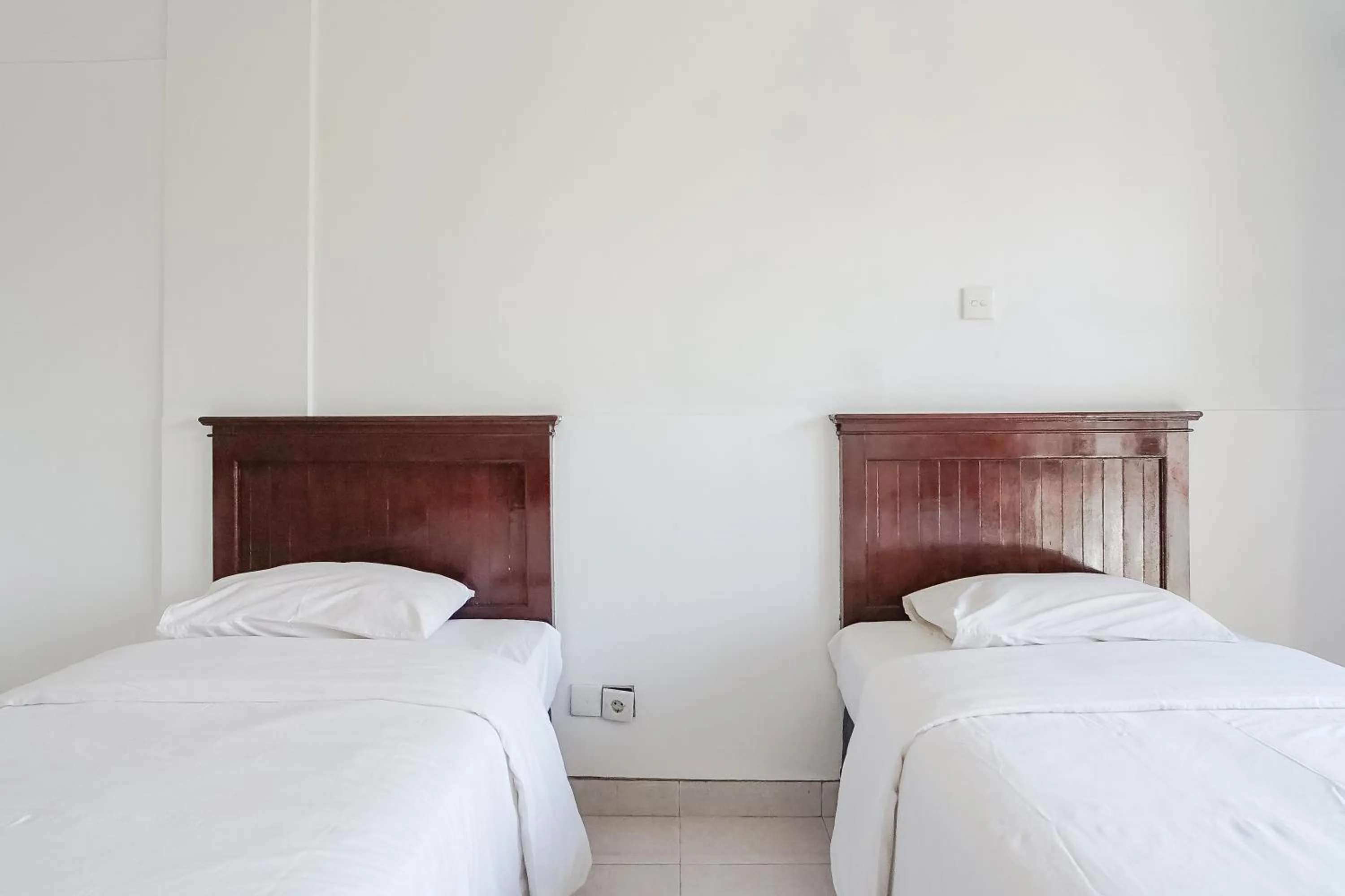 Bed in Indopurejoy House - Komala Indah Cottages