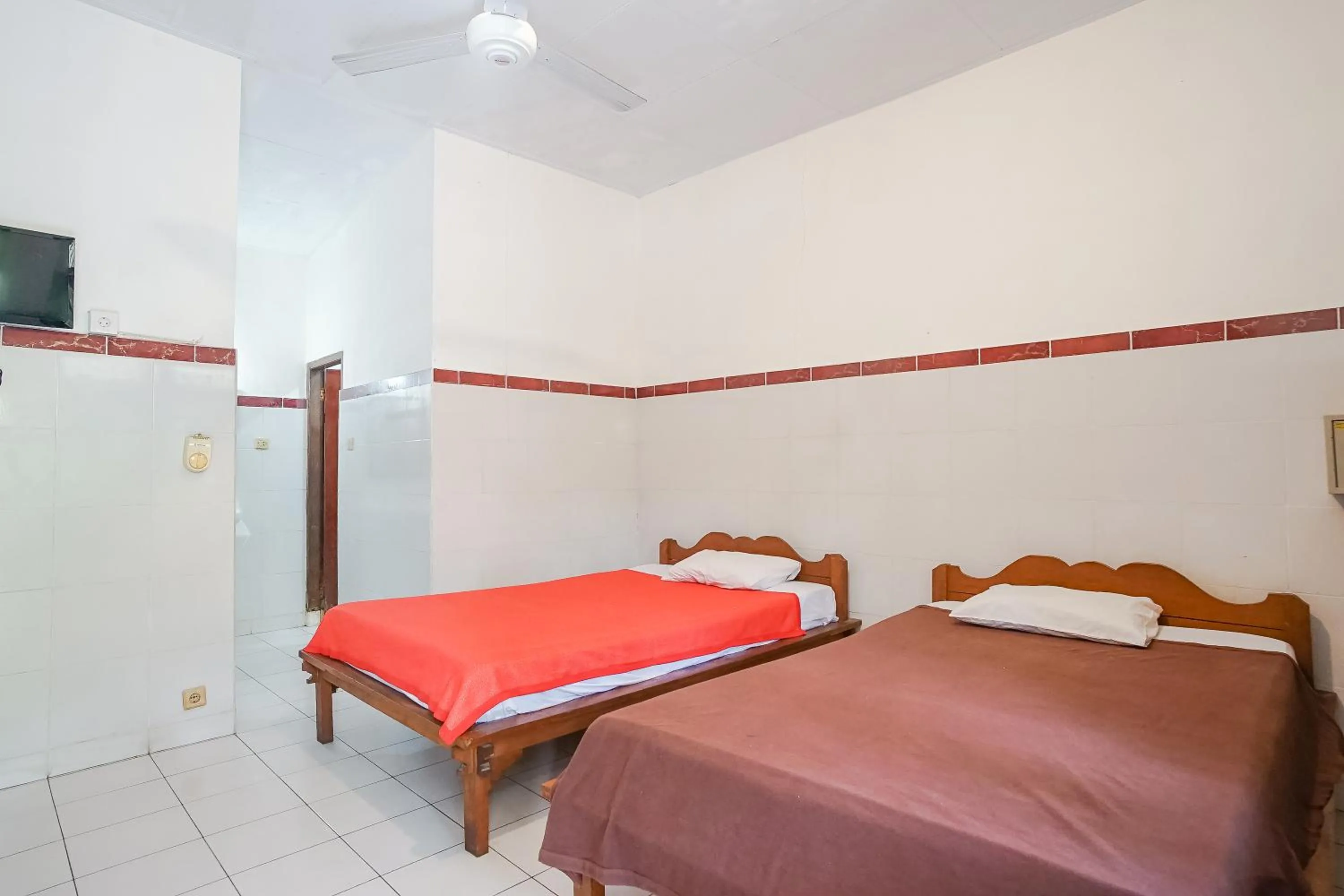 Bed in Indopurejoy House - Komala Indah Cottages