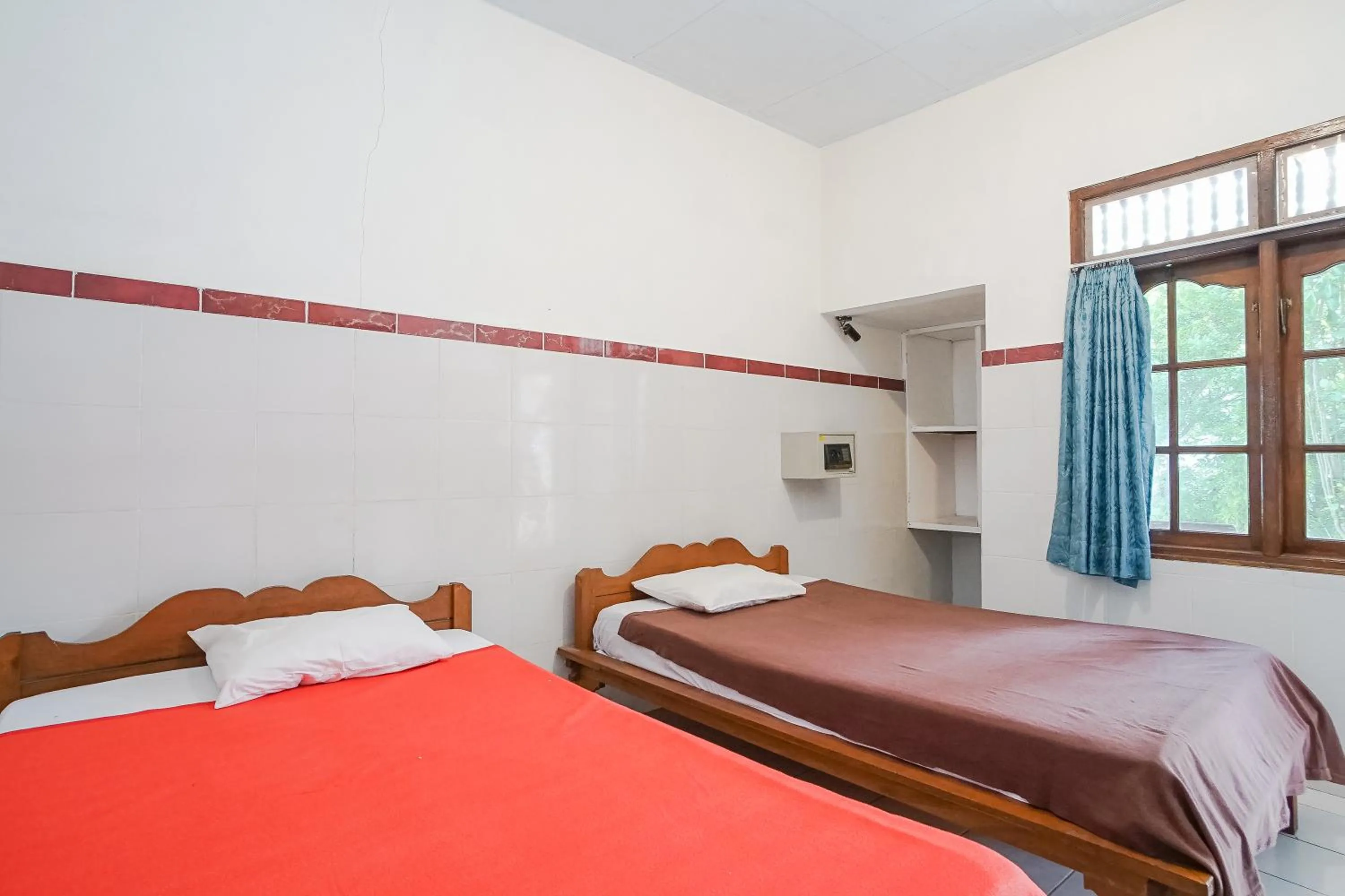 Bed in Indopurejoy House - Komala Indah Cottages