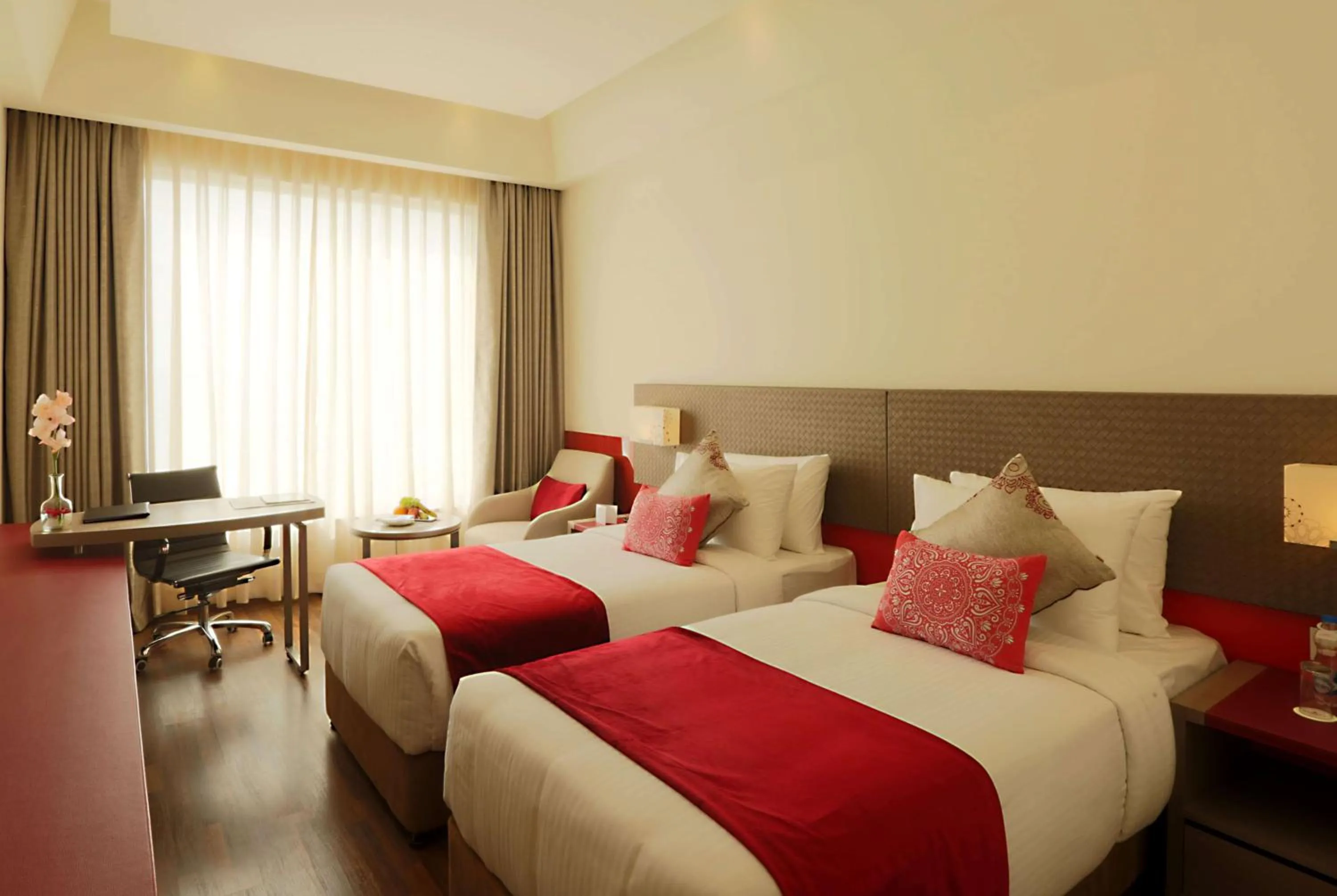 Photo of the whole room, Bed in Ramada by Wyndham Lucknow Hotel and Convention Center