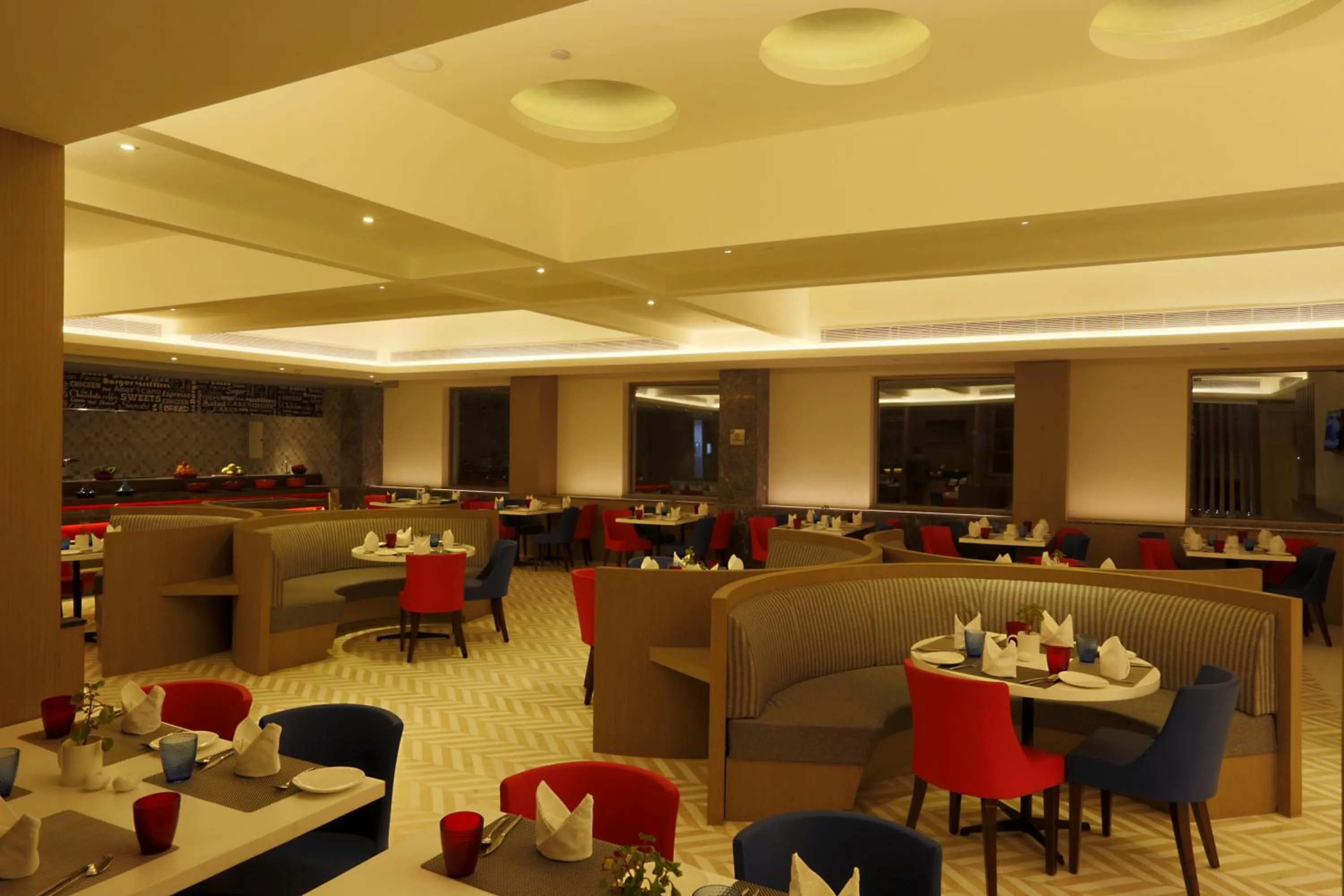 Dining area in Ramada by Wyndham Lucknow Hotel and Convention Center