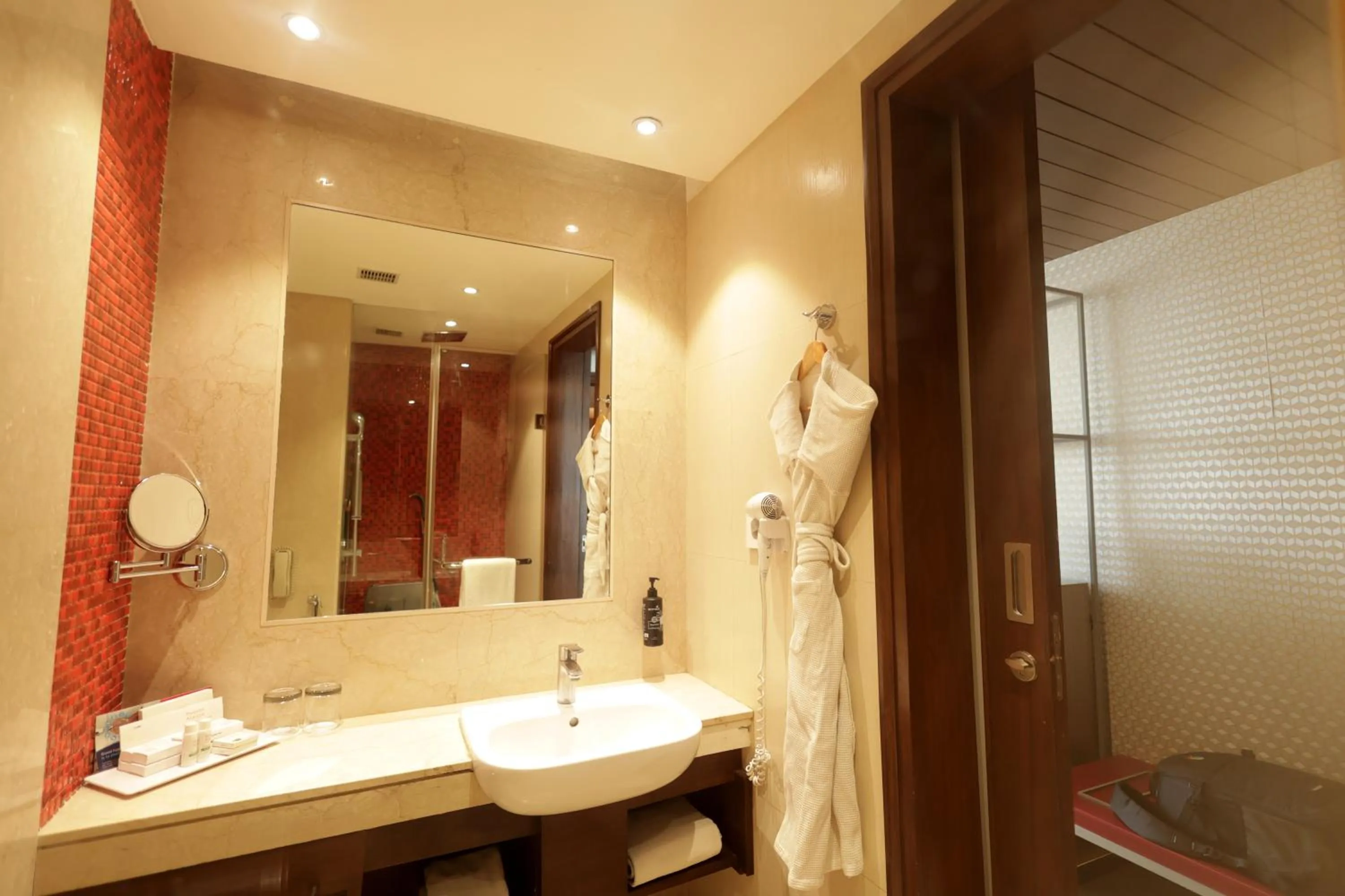 Bathroom in Ramada by Wyndham Lucknow Hotel and Convention Center
