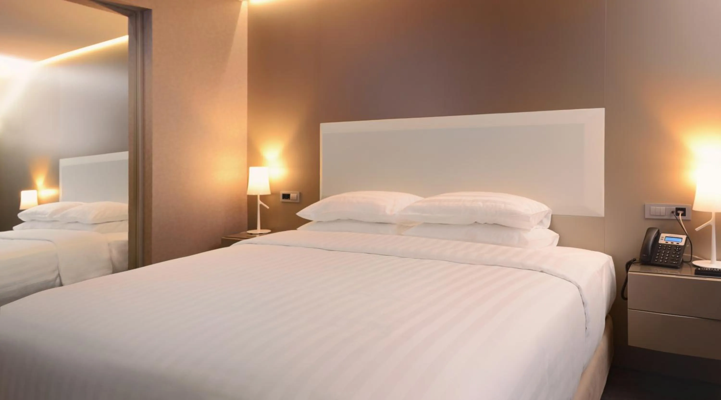 Bed in SAZ City Life Boutique Hotel