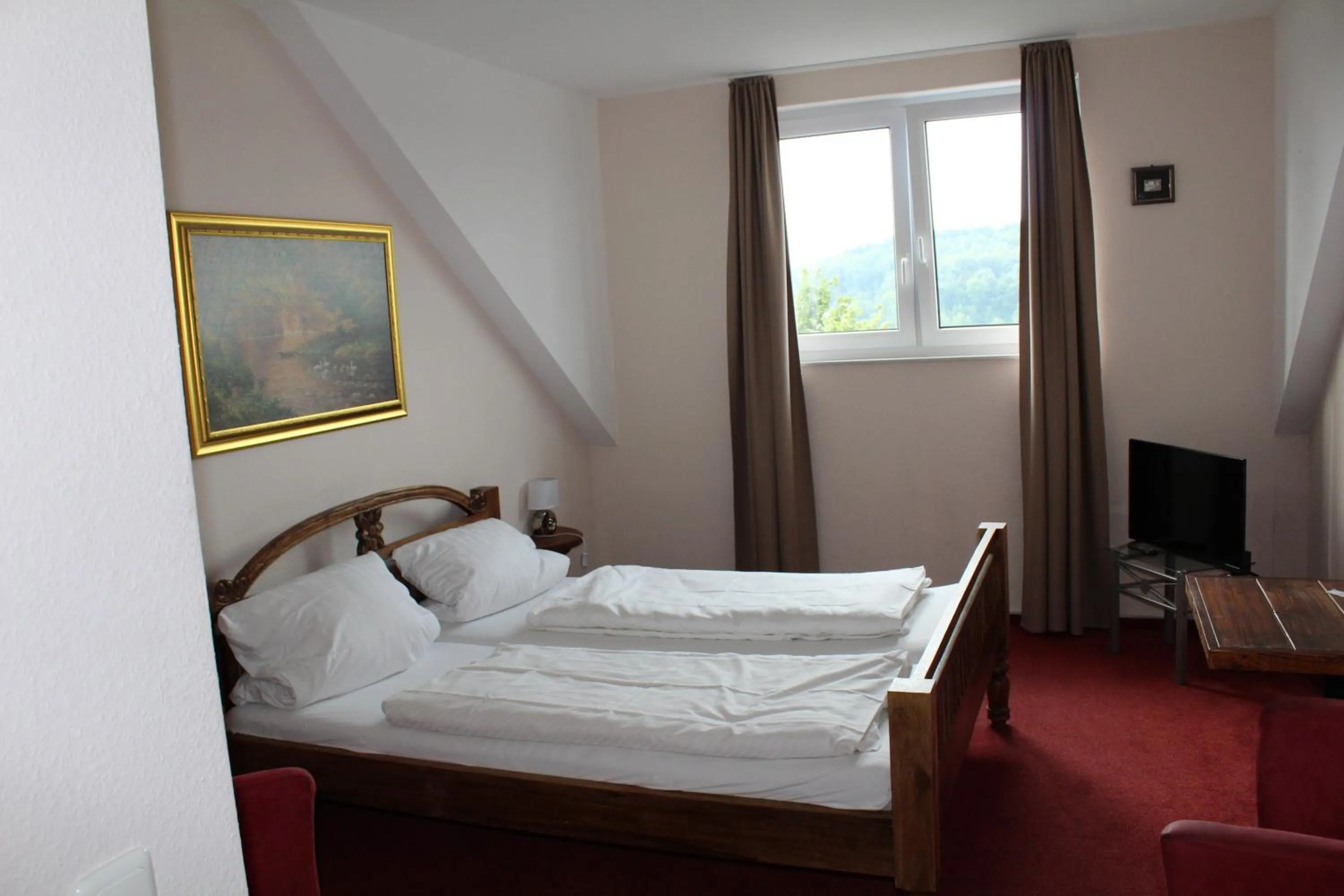 Bed in Hotel Gardenia