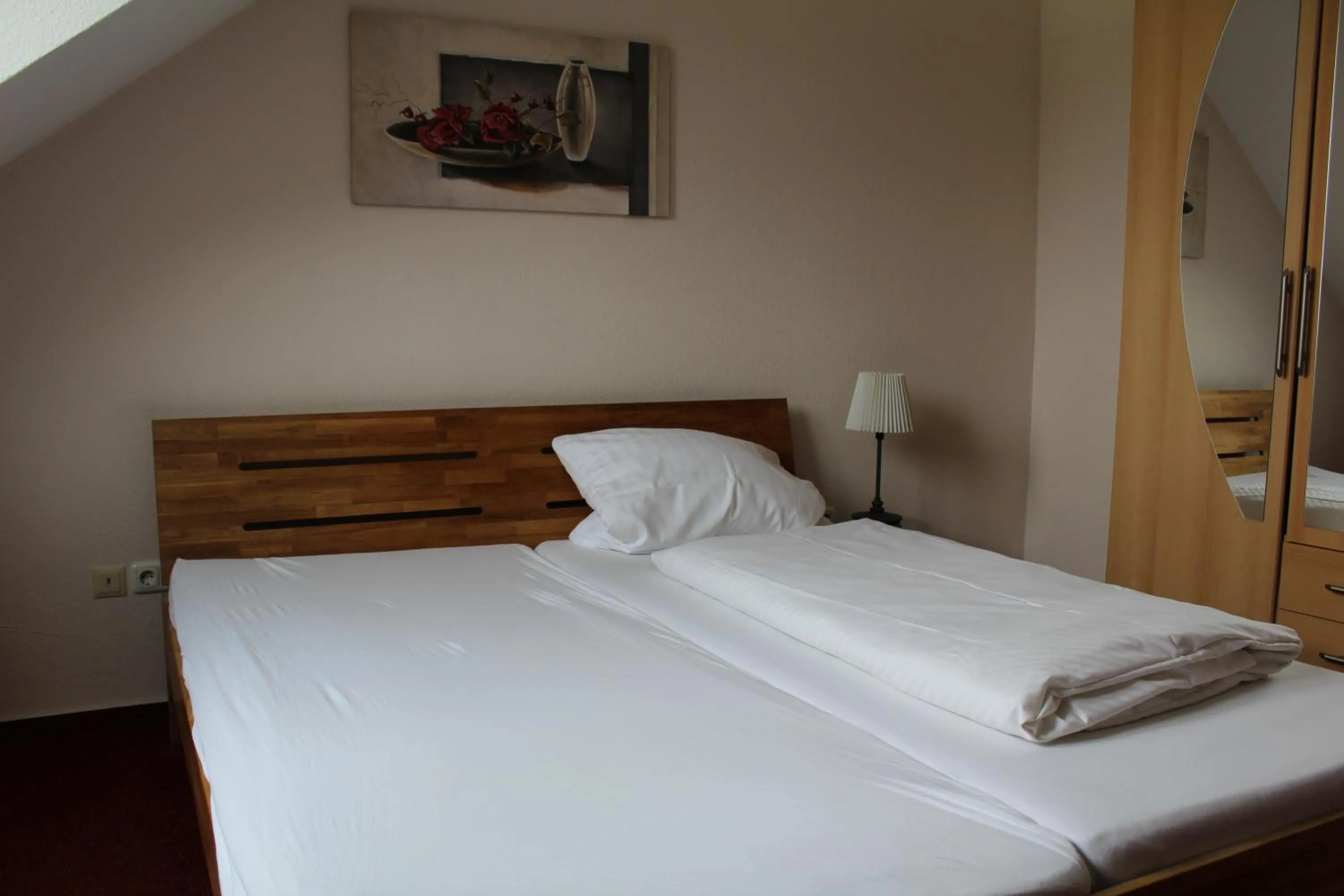 Bed in Hotel Gardenia