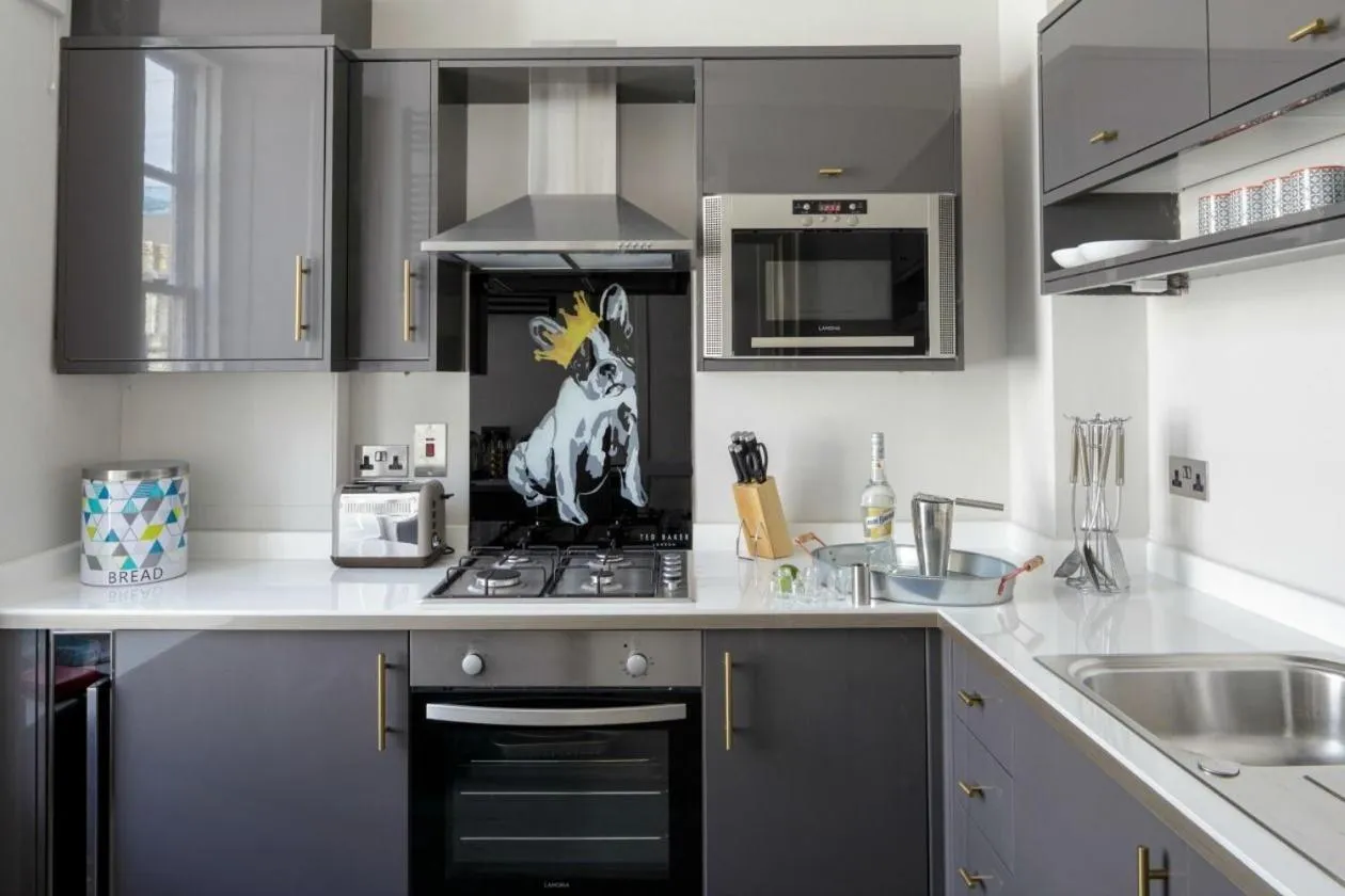 Kitchen or kitchenette in Unique Apartments - Beau Street