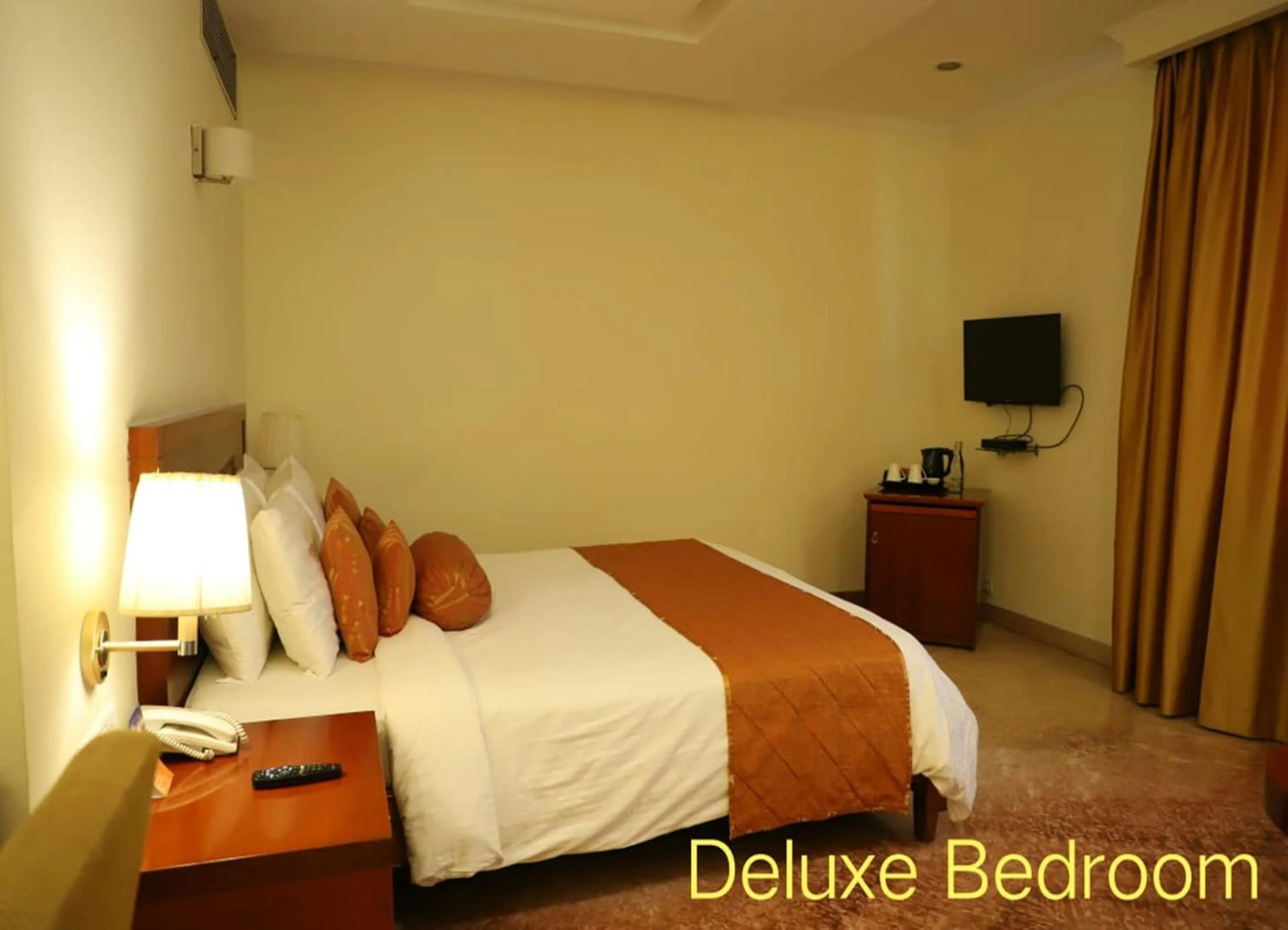 Photo of the whole room, Bed in Royal Sarovar Portico Siliguri