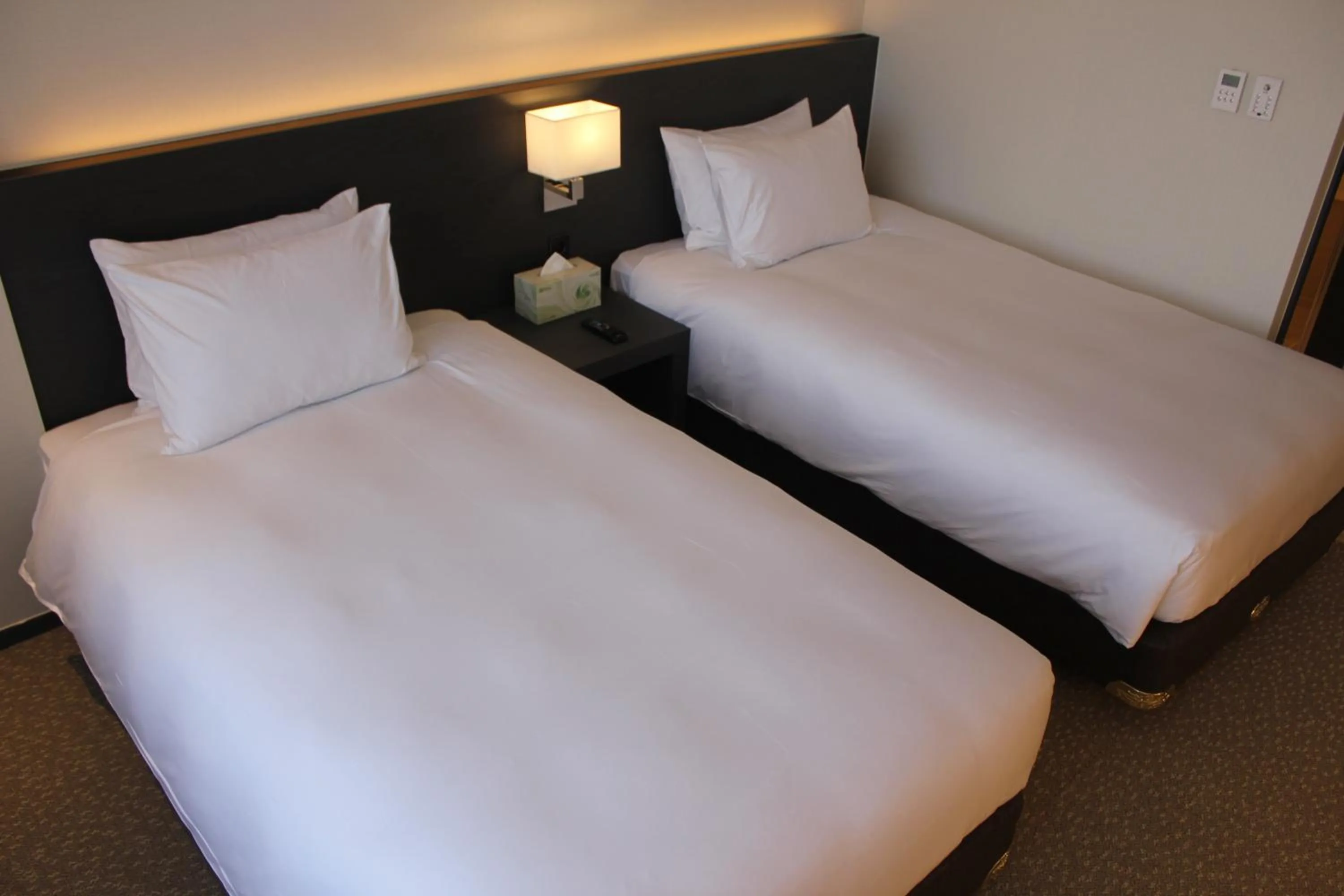 Bed in Geoje Artnouveau Suite Hotel