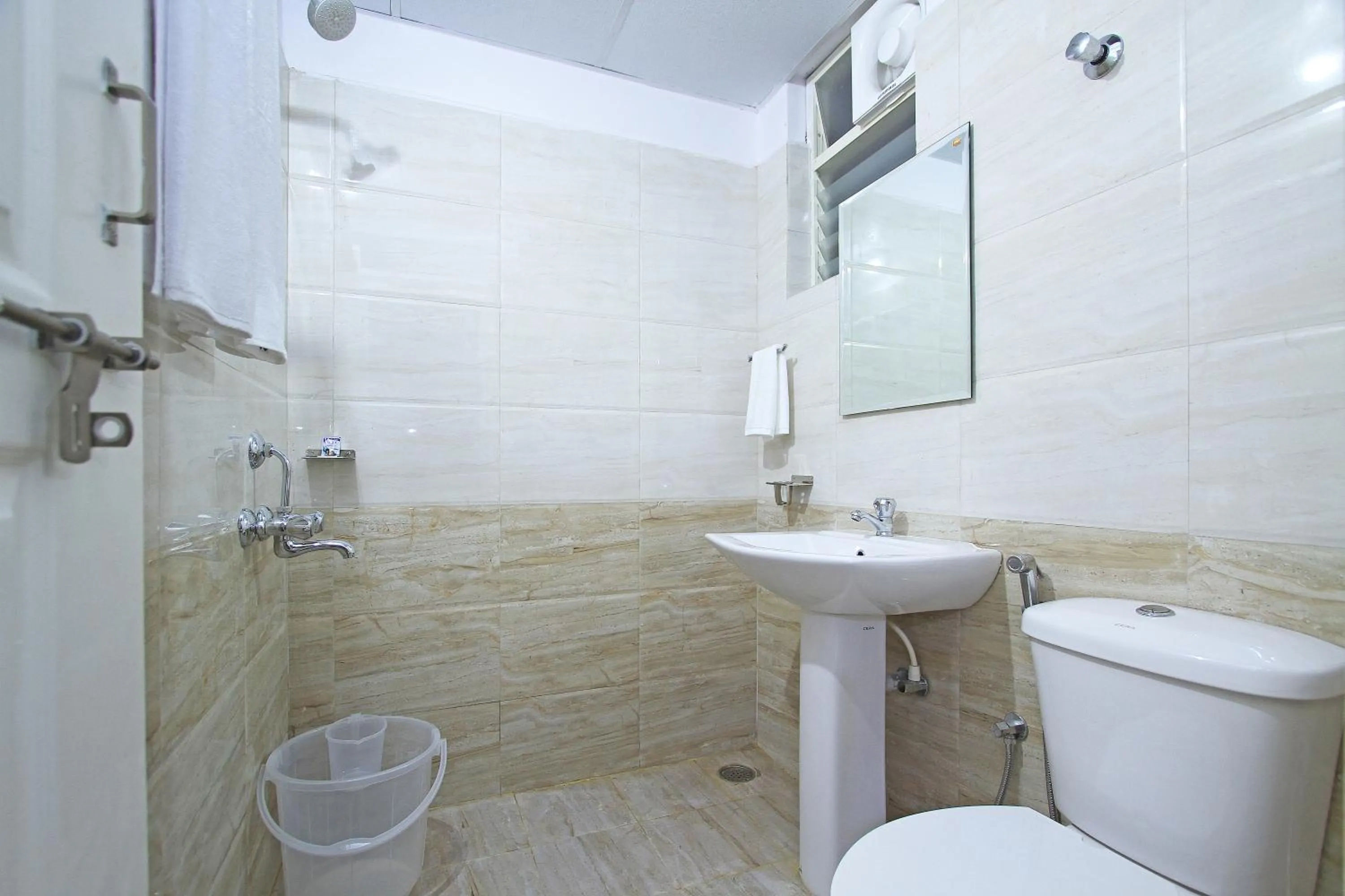 Bathroom in Arra Grande Suites Bangalore airport hotel