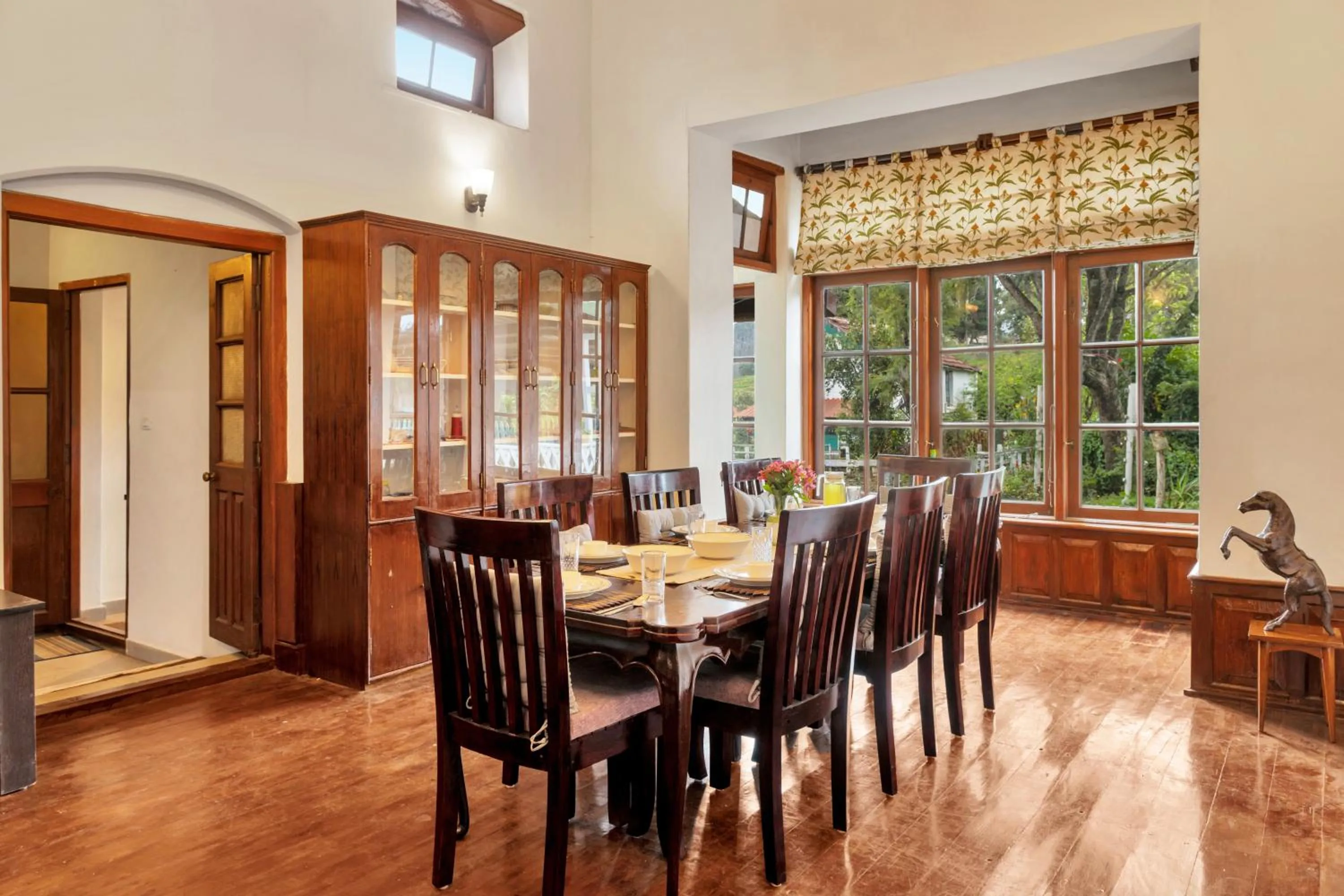 Dining area in SaffronStays Milton Abbott Estate - 2BR colonial-era bungalow with garden, golf course views & bonfire nights near Ooty Golf Club