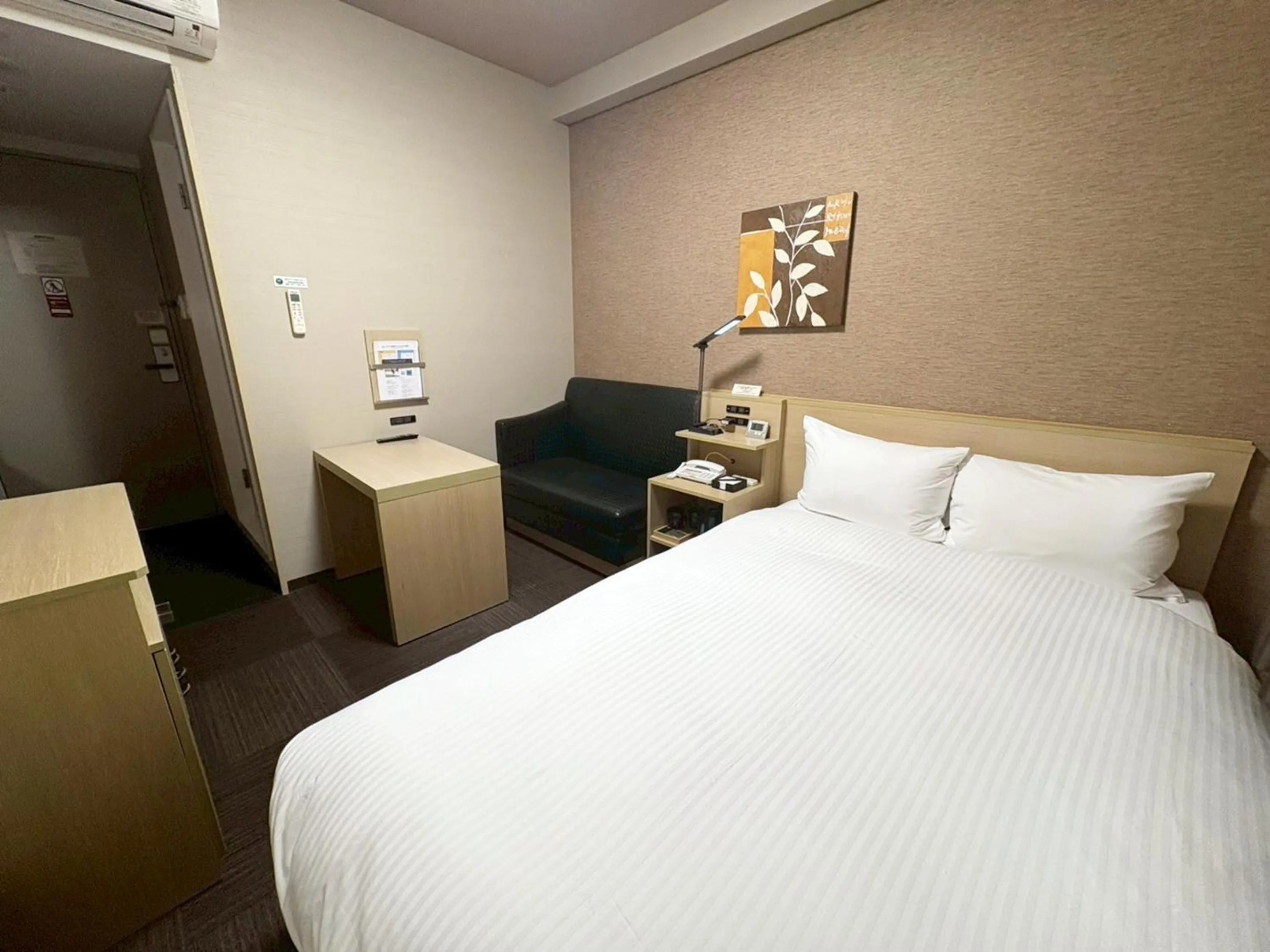 Photo of the whole room, Bed in Hotel Route-Inn Higashihiroshima Saijo Ekimae