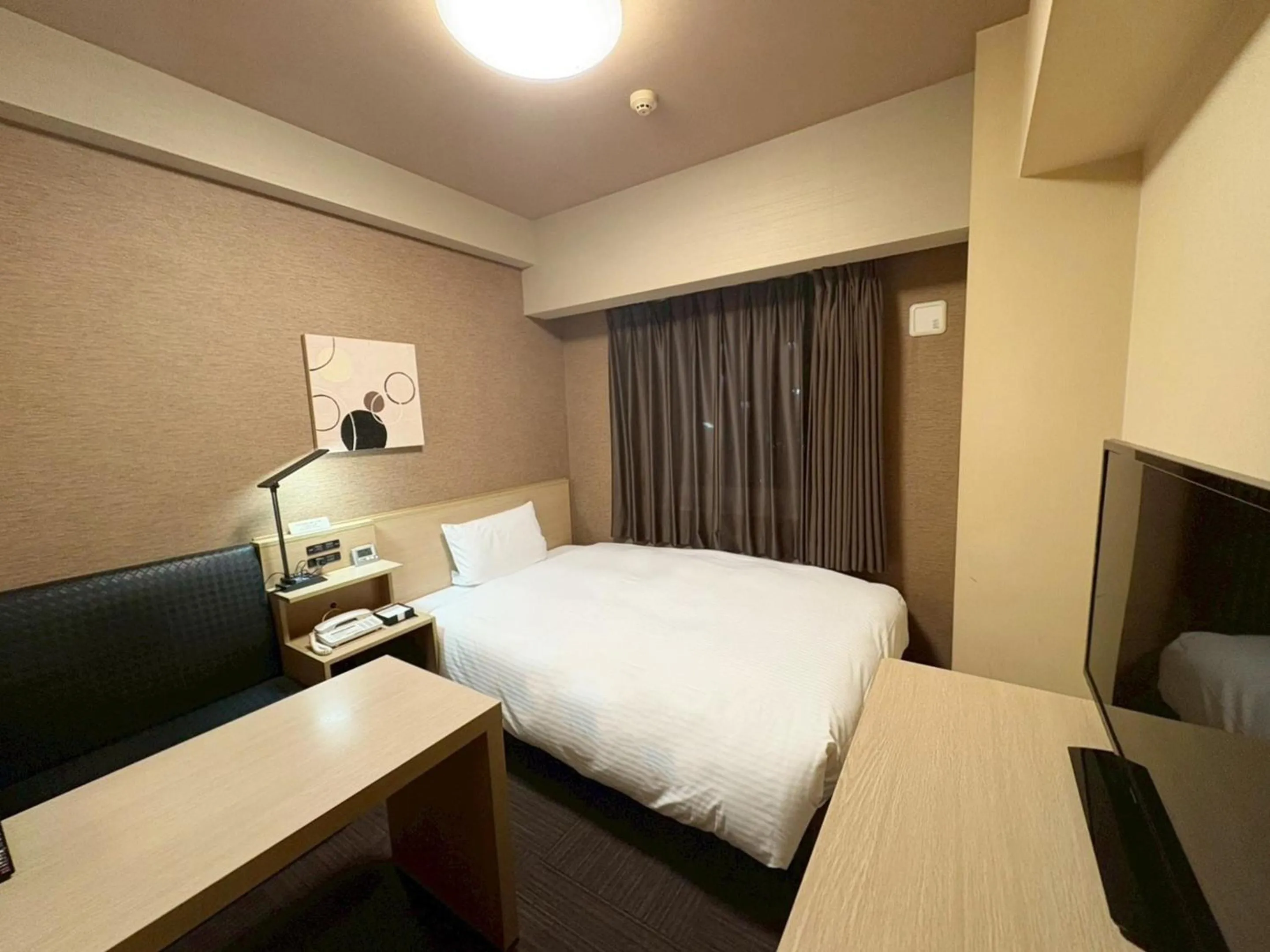 Photo of the whole room, Bed in Hotel Route-Inn Higashihiroshima Saijo Ekimae