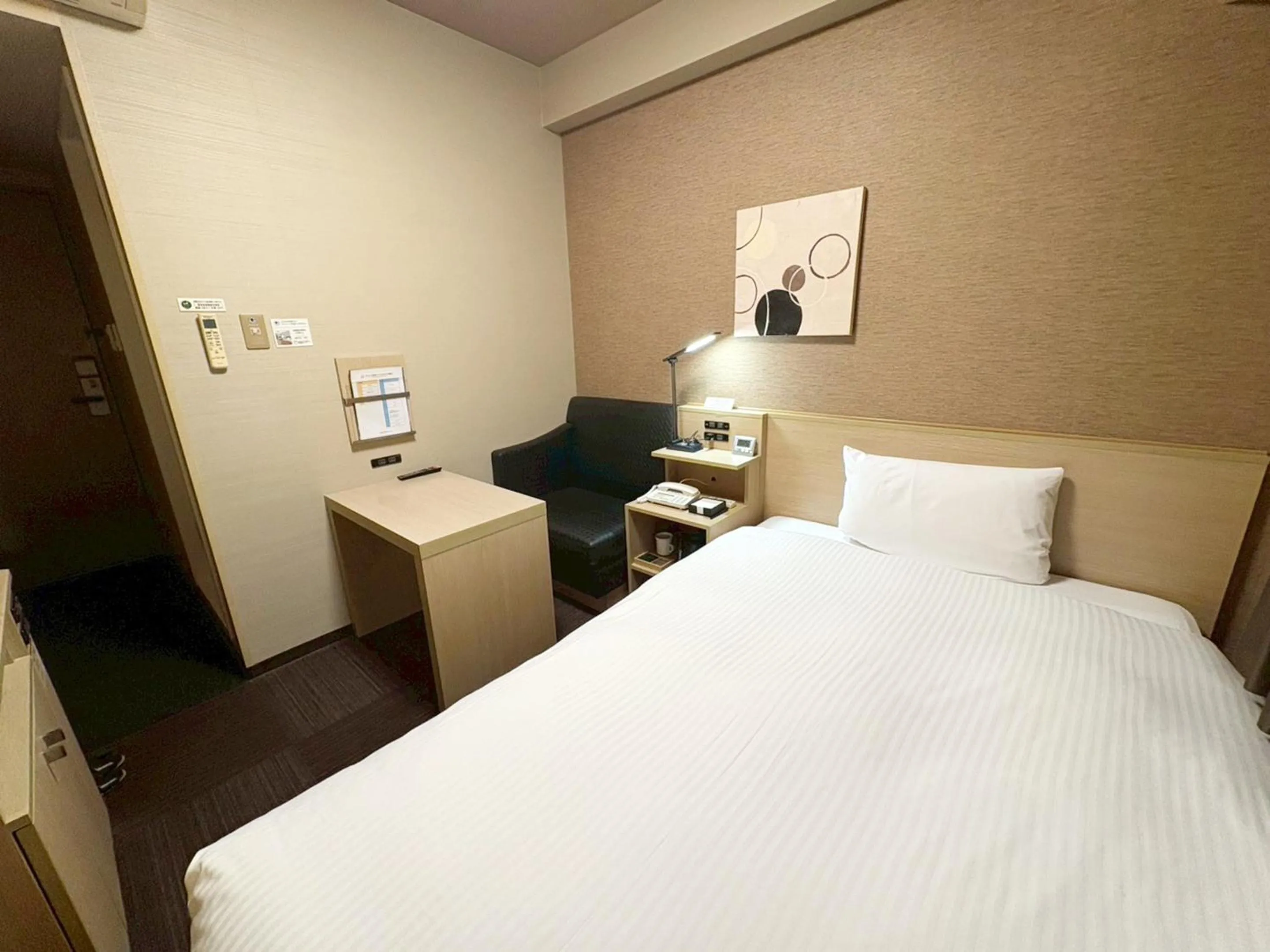 Photo of the whole room, Bed in Hotel Route-Inn Higashihiroshima Saijo Ekimae