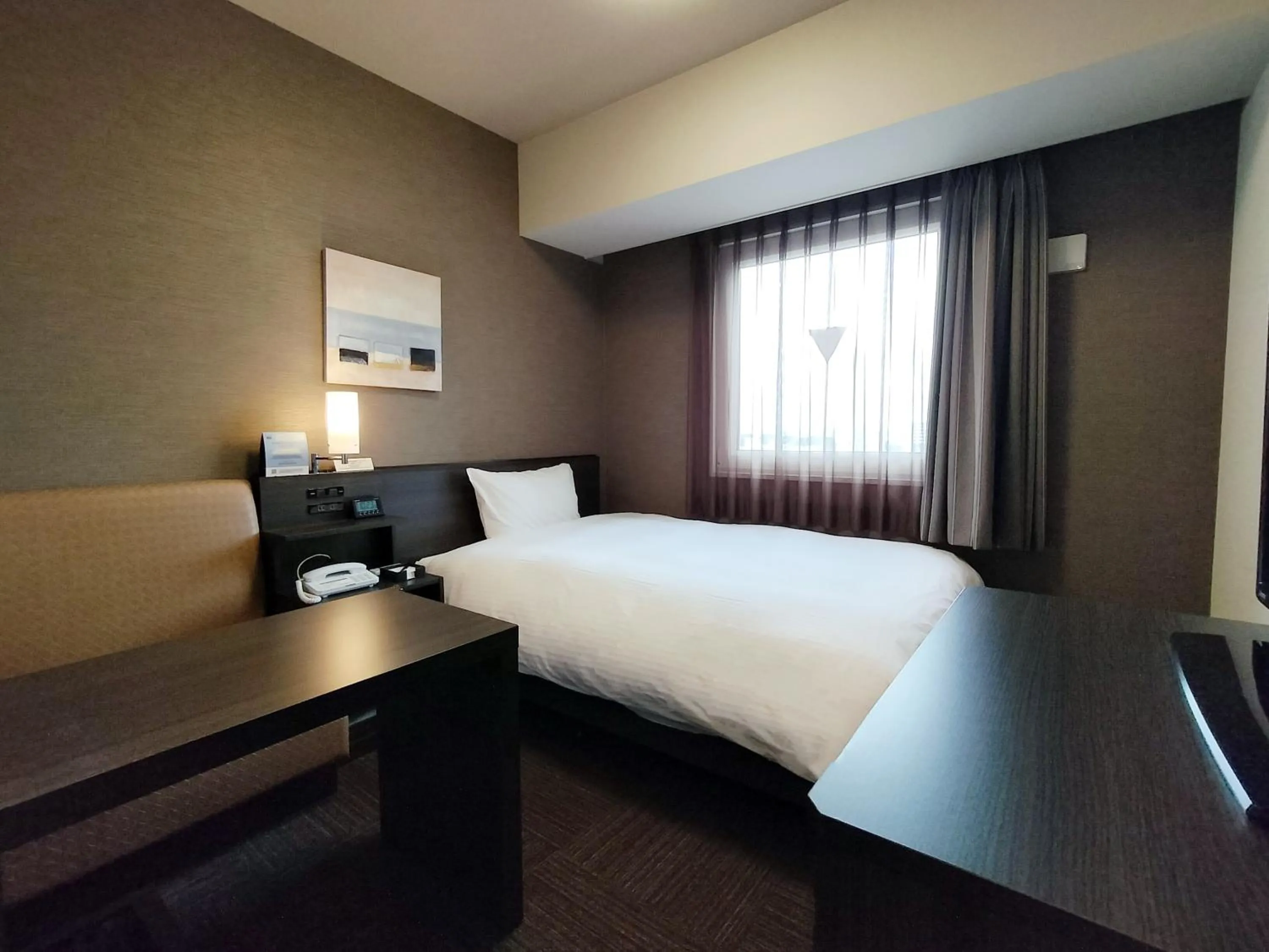 Photo of the whole room, Bed in Hotel Route-Inn Takaoka Ekimae