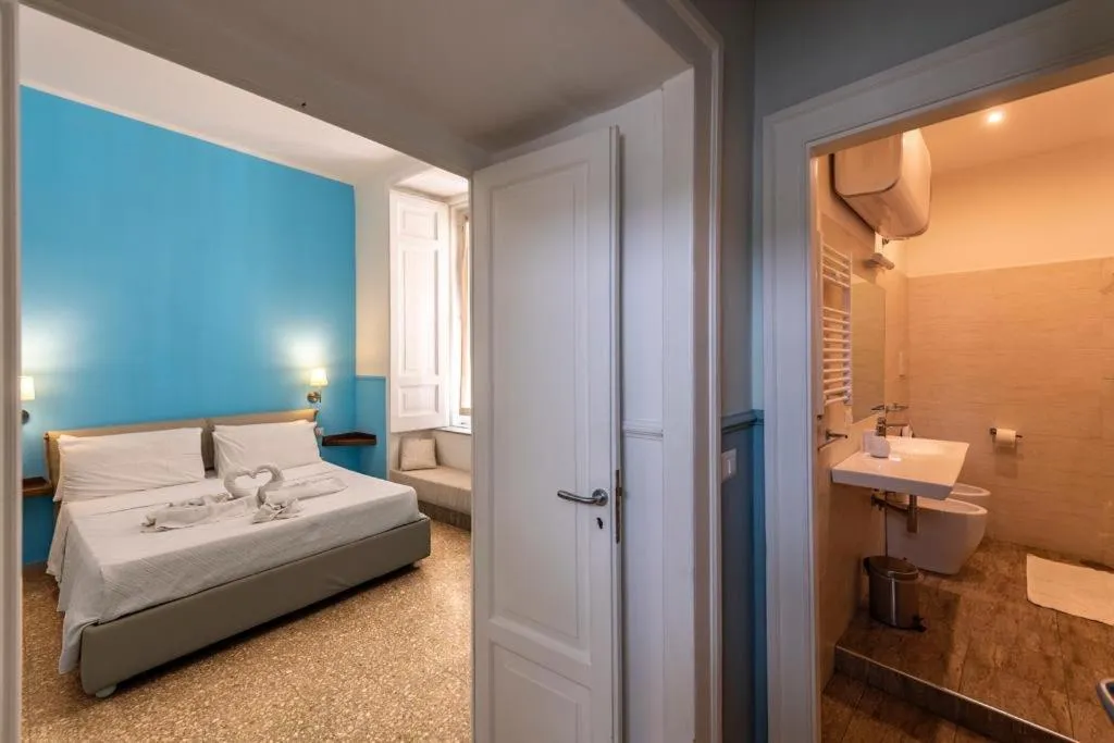 Bed in Aragonese Luxury Rooms