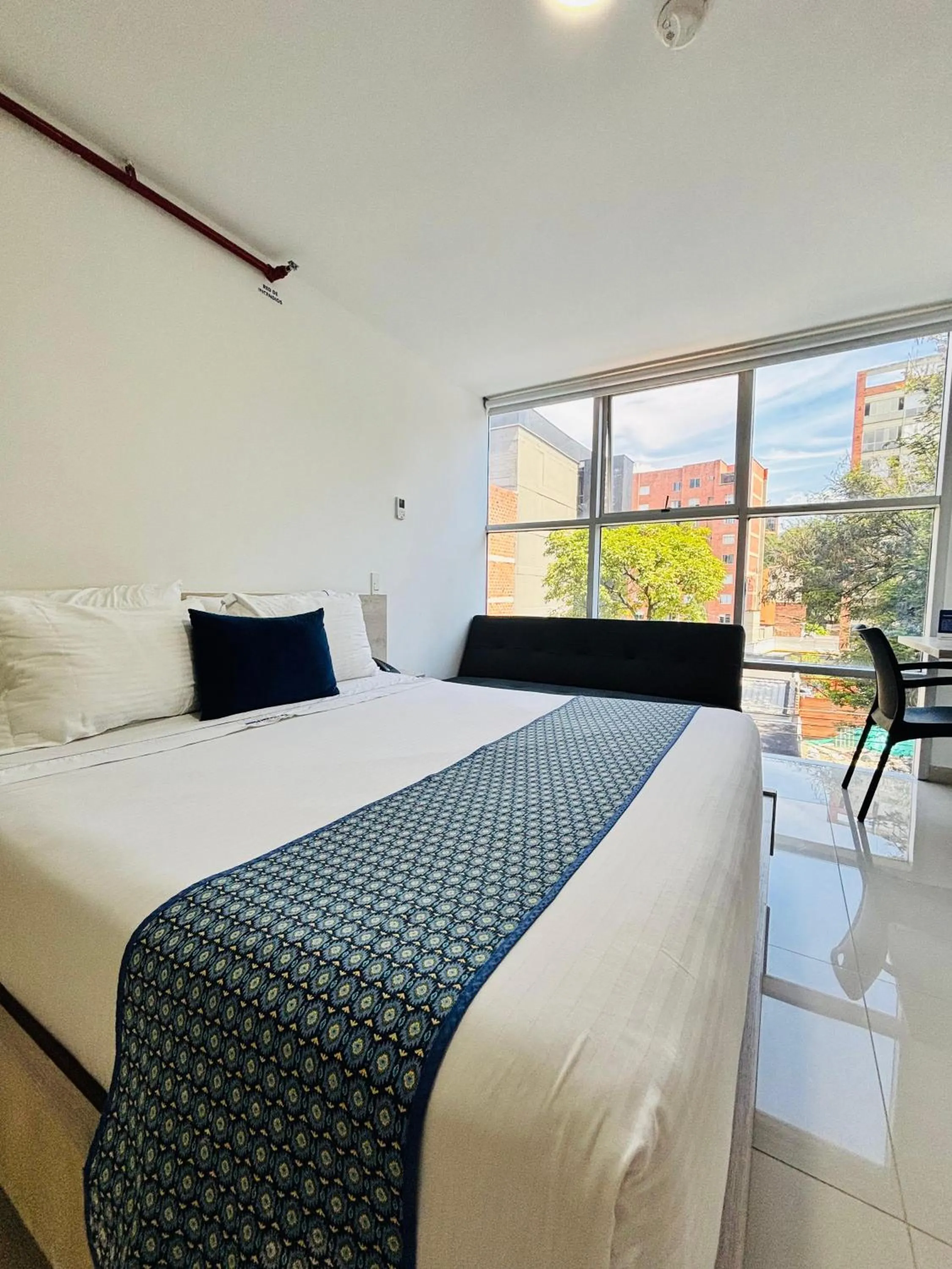 Bed in Hotel Laureles Plaza